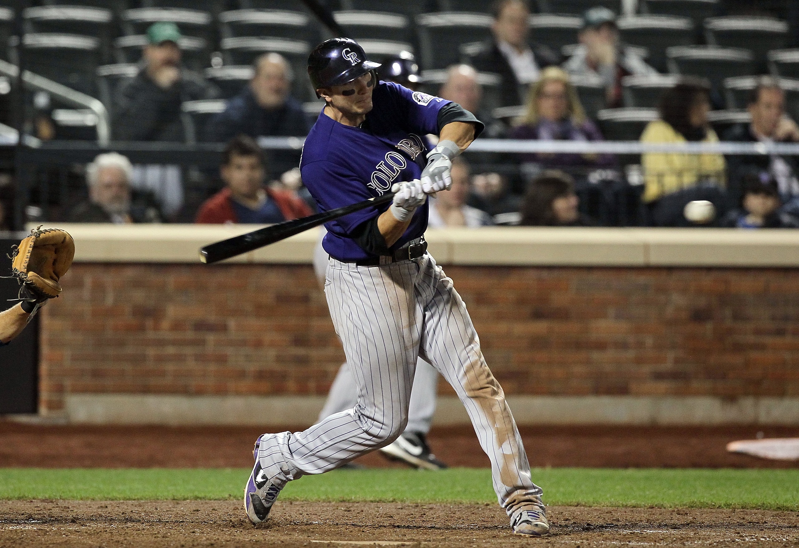 NEW YORK, NY - APRIL 11:  Troy Tulowitzki #2 of the Colorado Rockies connects on a seventh inning two-run home run against of the New York Mets on April 11, 2011 at Citi Field in the Flushing neighborhood of the Queens borough of New York City.  (Photo by