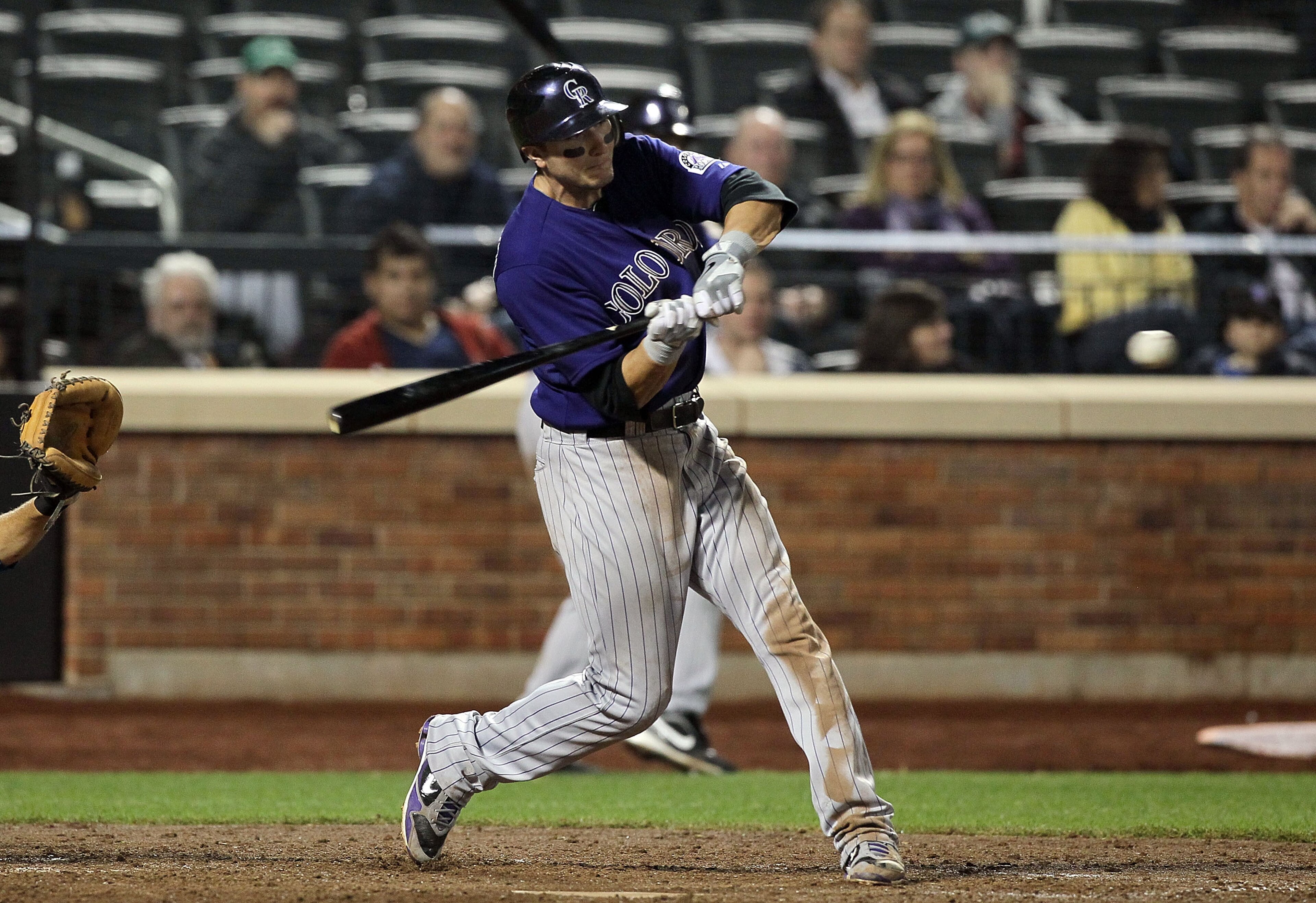 NEW YORK, NY - APRIL 11:  Troy Tulowitzki #2 of the Colorado Rockies connects on a seventh inning two-run home run against of the New York Mets on April 11, 2011 at Citi Field in the Flushing neighborhood of the Queens borough of New York City.  (Photo by