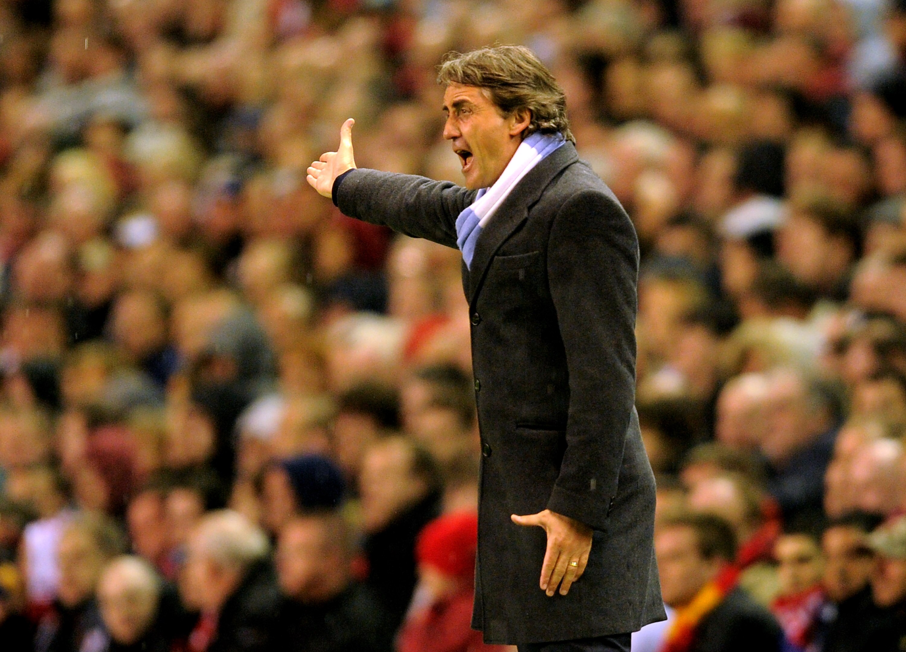 LIVERPOOL, ENGLAND - APRIL 11:  Manchester City Manager Roberto Mancini reacts during the Barclays Premier League match between Liverpool and Manchester City at Anfield on April 11, 2011 in Liverpool, England.  (Photo by Michael Regan/Getty Images)