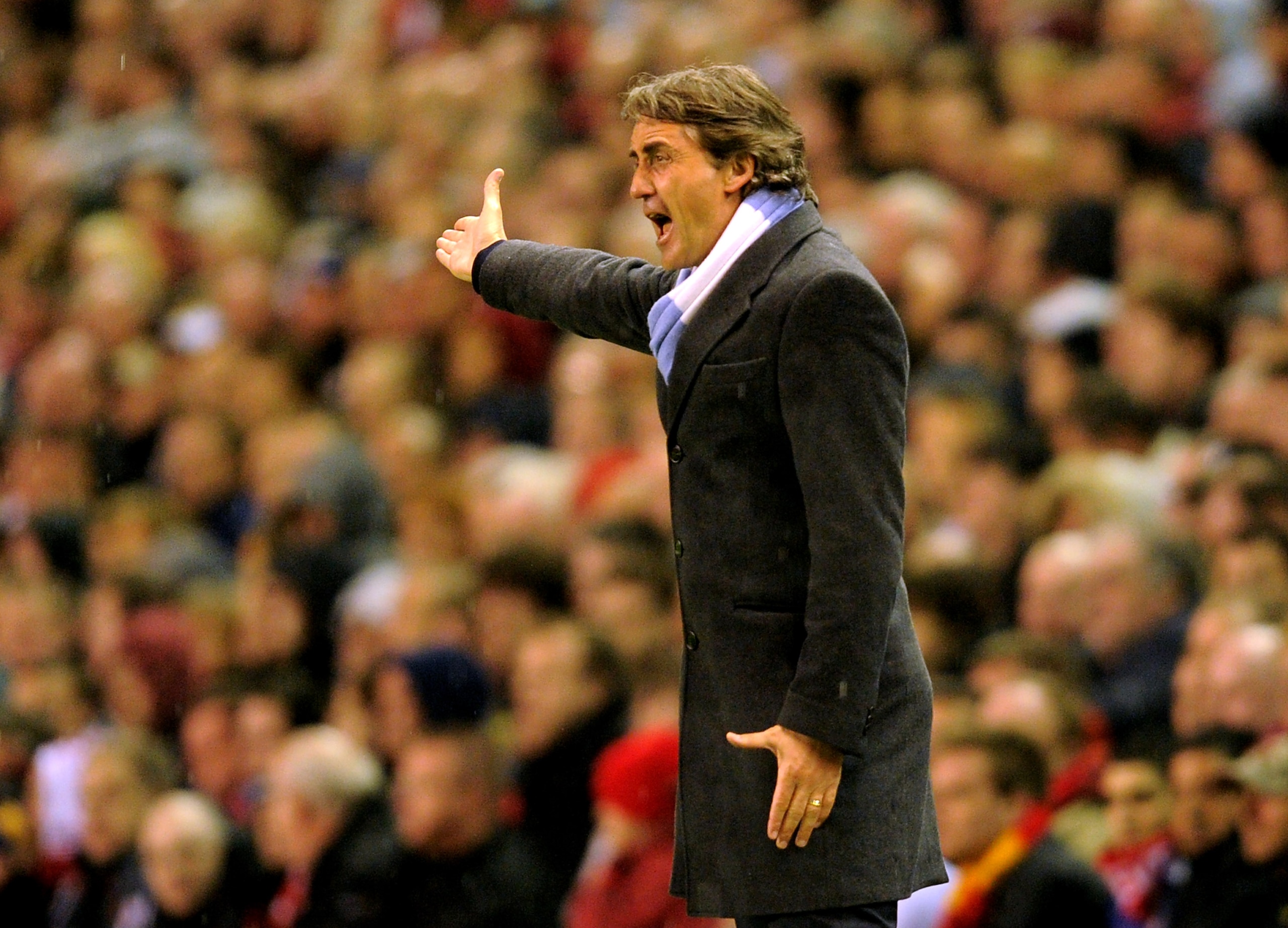 LIVERPOOL, ENGLAND - APRIL 11: Manchester City Manager Roberto Mancini reacts during the Barclays Premier League match between Liverpool and Manchester City at Anfield on April 11, 2011 in Liverpool, England. (Photo by Michael Regan/Getty Images) LIVERPOOL, ENGLAND - APRIL 11: Manchester City Manager Roberto Mancini reacts during the Barclays Premier League match between Liverpool and Manchester City at Anfield on April 11, 2011 in Liverpool, England. (Photo by Michael Regan/Getty Images)
