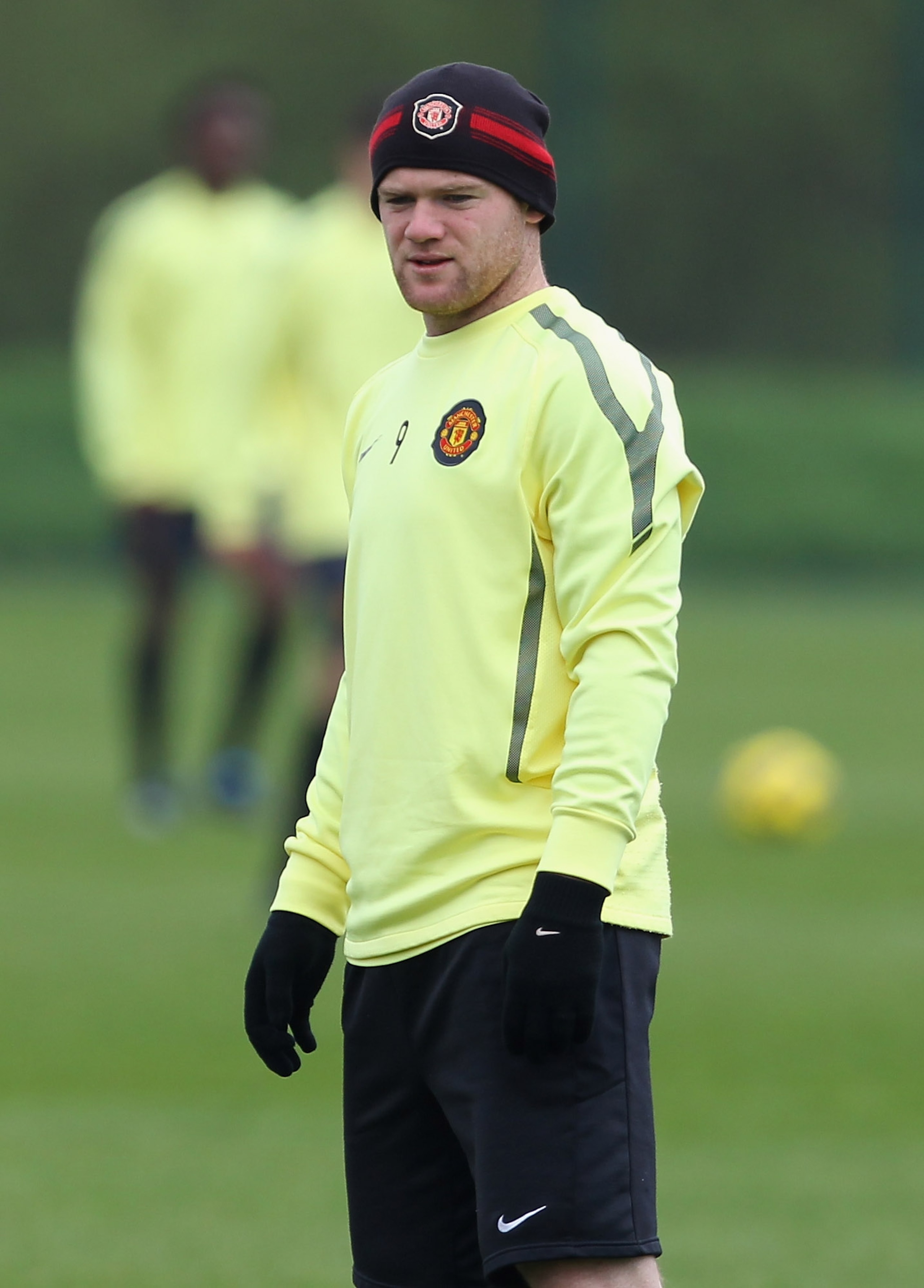 MANCHESTER, ENGLAND - APRIL 11: Wayne Rooney of Manchester United looks on during a training session ahead of their UEFA Champions League quarter final second leg match against Chelsea at the Carrington Training Complex on April 11, 2011 in Manchester, E MANCHESTER, ENGLAND - APRIL 11: Wayne Rooney of Manchester United looks on during a training session ahead of their UEFA Champions League quarter final second leg match against Chelsea at the Carrington Training Complex on April 11, 2011 in Manchester, E