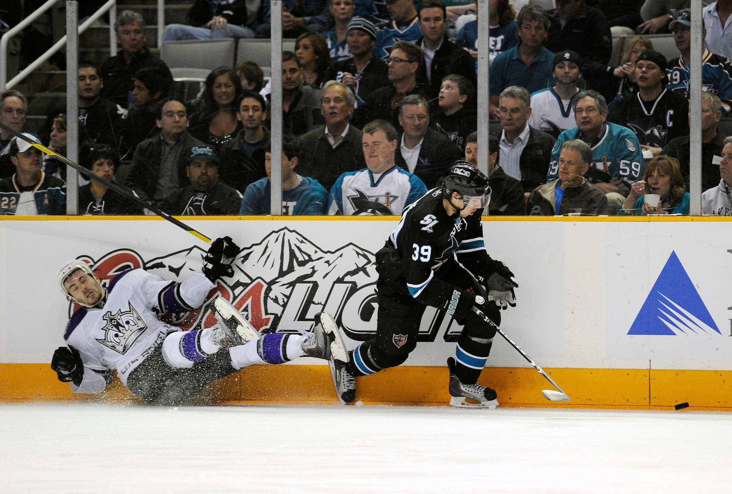 SAN JOSE, CA - APRIL 14: Logan Couture #39 of the San Jose Sharks breaks away with the puck and head towards the goal against the Los Angeles Kings in Game One of the Western Conference Quarterfinals  during the 2011 NHL Stanley Cup Playoffs at the HP Pav
