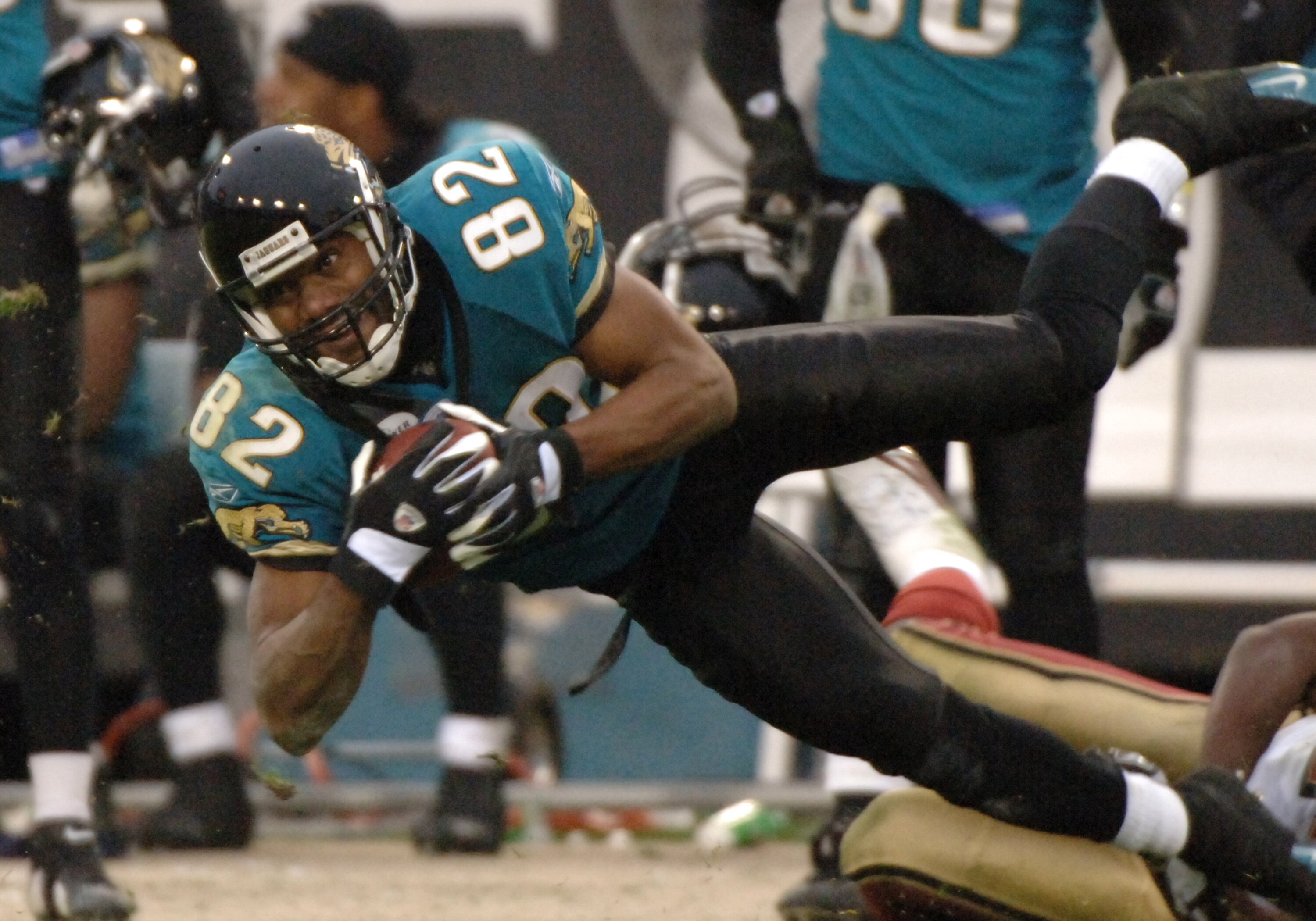 Jacksonville Jaguars wide receiver Jimmy Smith grabs a pass  at midfield against the San Francisco 49ers  December 18, 2005 in Jacksonville.  The Jaguars won 10 - 9.  (Photo by Al Messerschmidt/Getty Images)