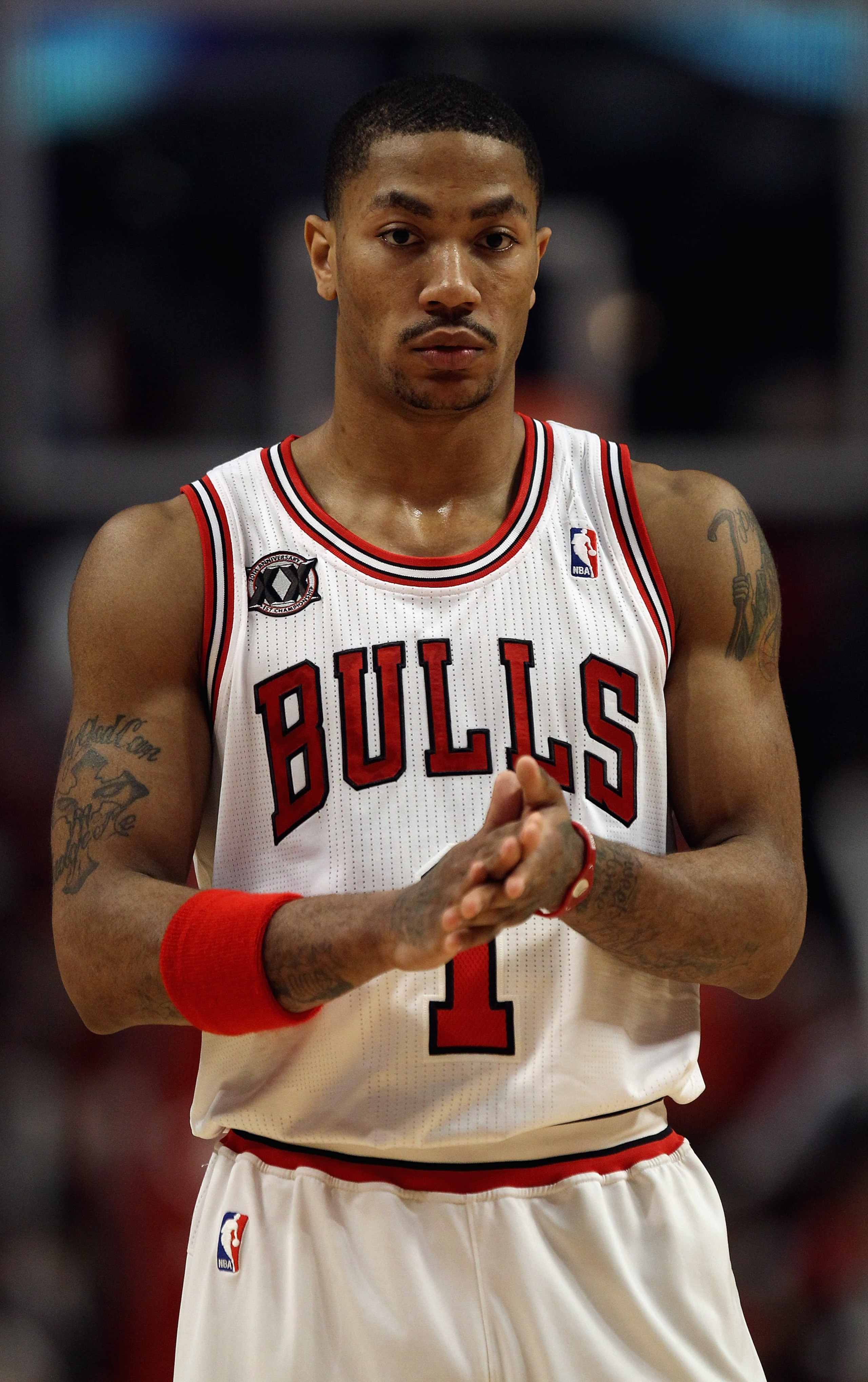 CHICAGO, IL - APRIL 13: Derrick Rose #1 of the Chicago Bulls awaits the start of play after a time-out against the New Jersey Nets at United Center on April 13, 2011 in Chicago, Illinois. The Bulls defeated the Nets 97-92. NOTE TO USER: User expressly ack