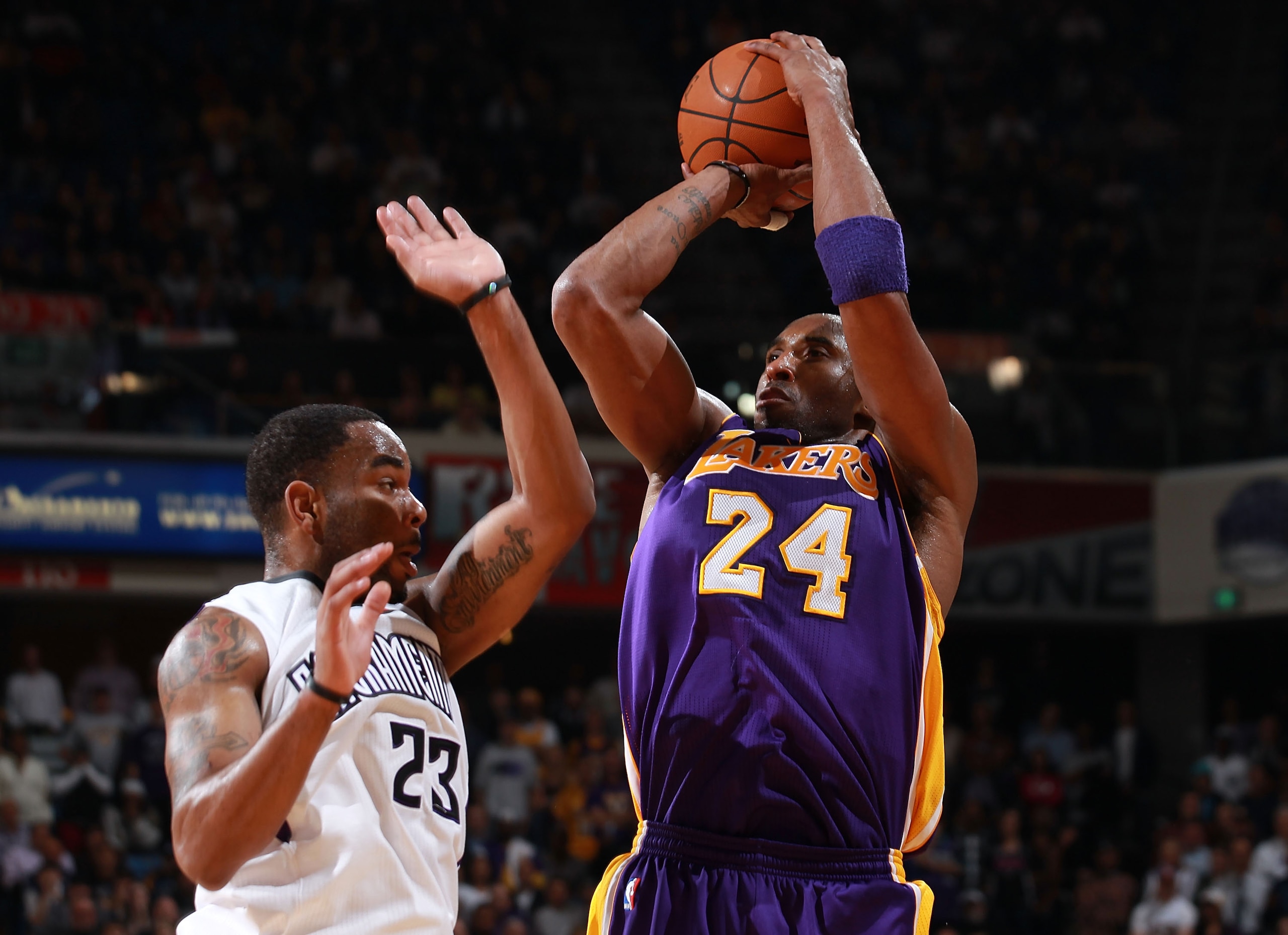 SACRAMENTO, CA - APRIL 13:  Kobe Bryant #24 of the Los Angeles Lakers shoots against Marcus Thornton #23 of the Sacramento Kings look on against  on April 13, 2011 at Power Balence Pavilion in Sacramento, California. NOTE TO USER: User expressly acknowled