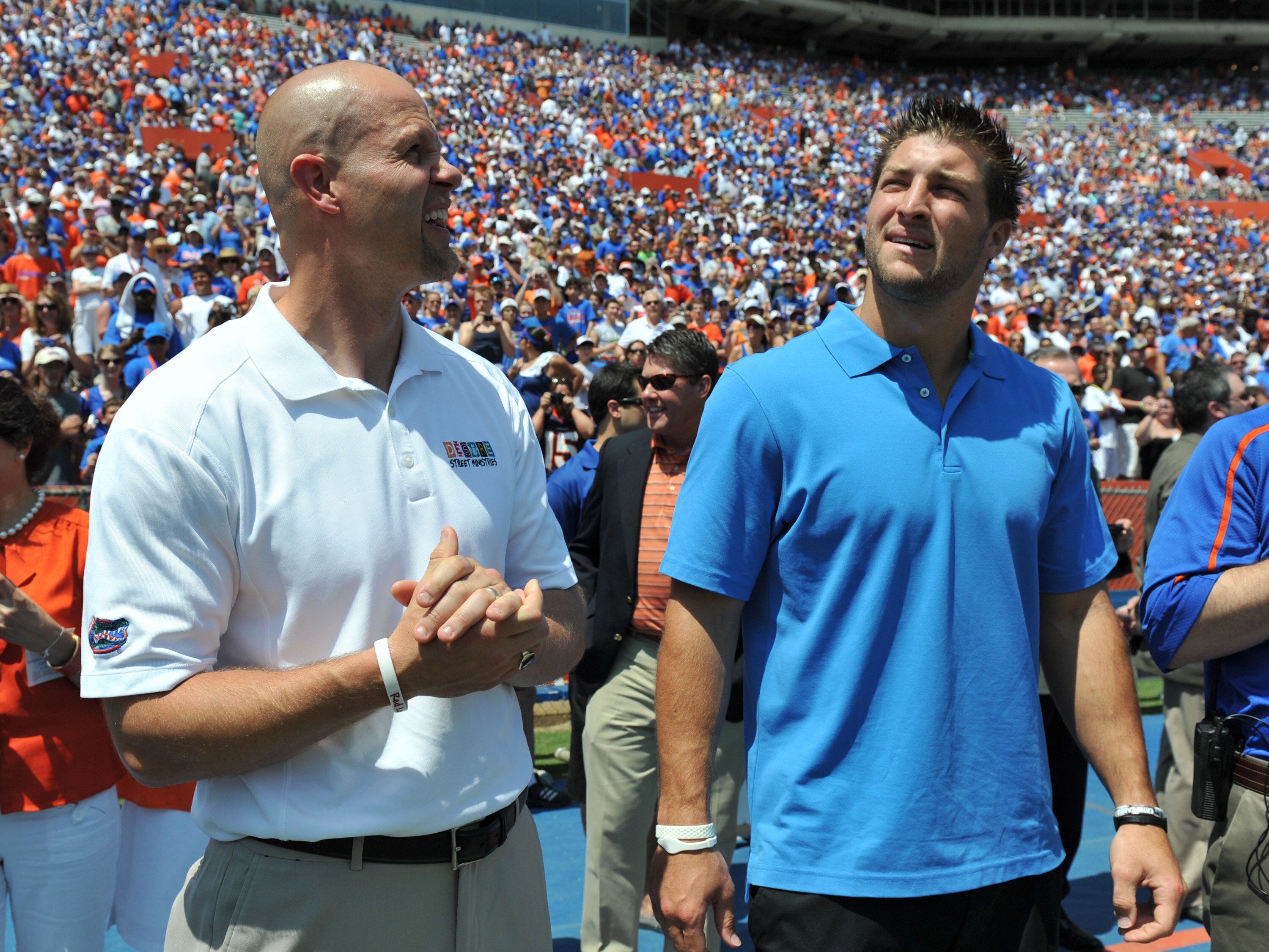 GAINESVILLE, FL - APRIL 9: Danny Wuerffel and Tim Tebow watch a scoreboard as life-size statues of the Florida Gators three Heisman trophy winners are unvelied at halftime of the Orange and Blue spring football game April 9, 2011 Ben Hill Griffin Stadium