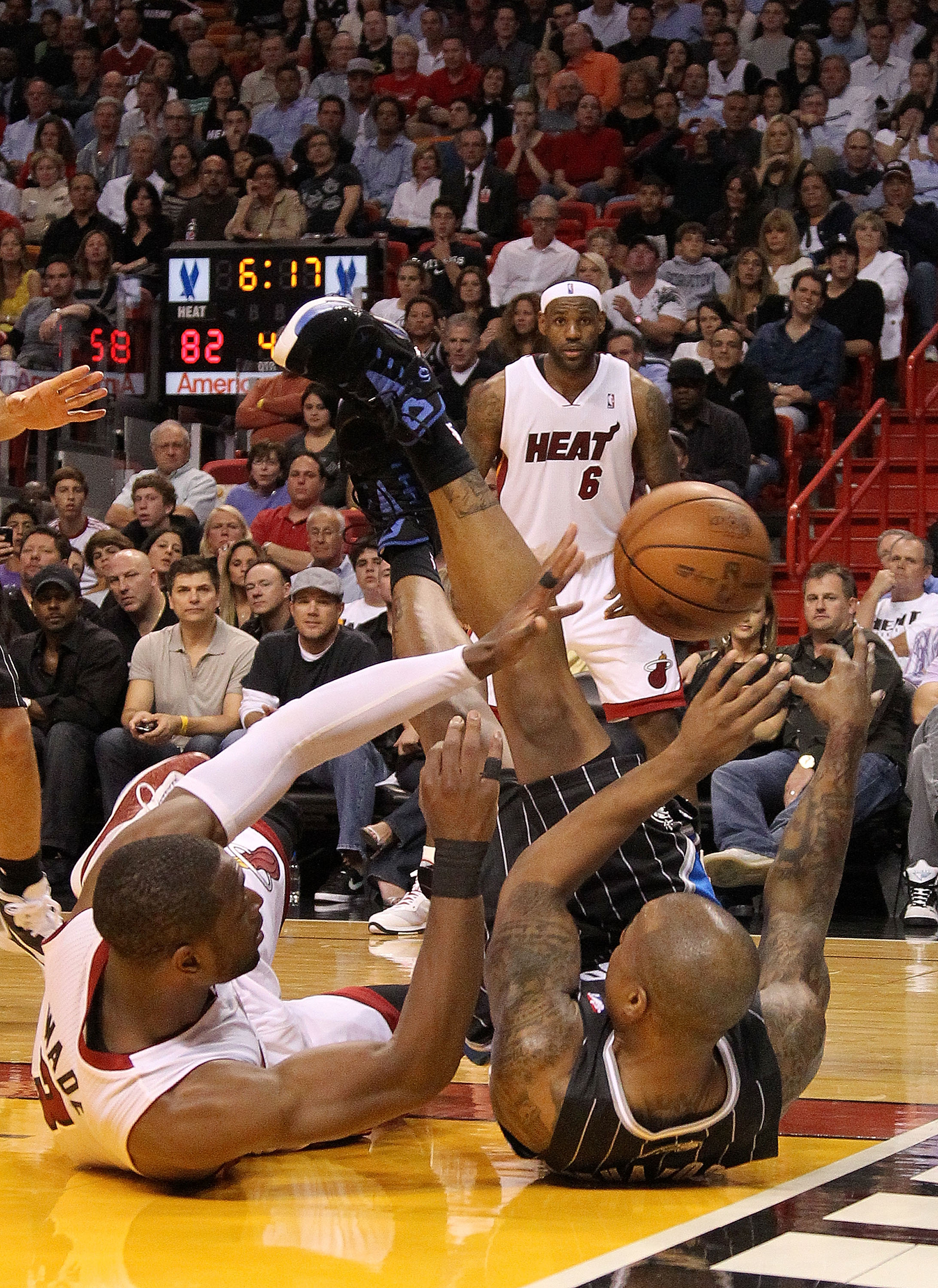 MIAMI, FL - MARCH 03:  Quentin Richardson #5 of the Orlando Magic tangles with Dwyane Wade #3 of the Miami Heat during a game at American Airlines Arena on March 3, 2011 in Miami, Florida. NOTE TO USER: User expressly acknowledges and agrees that, by down
