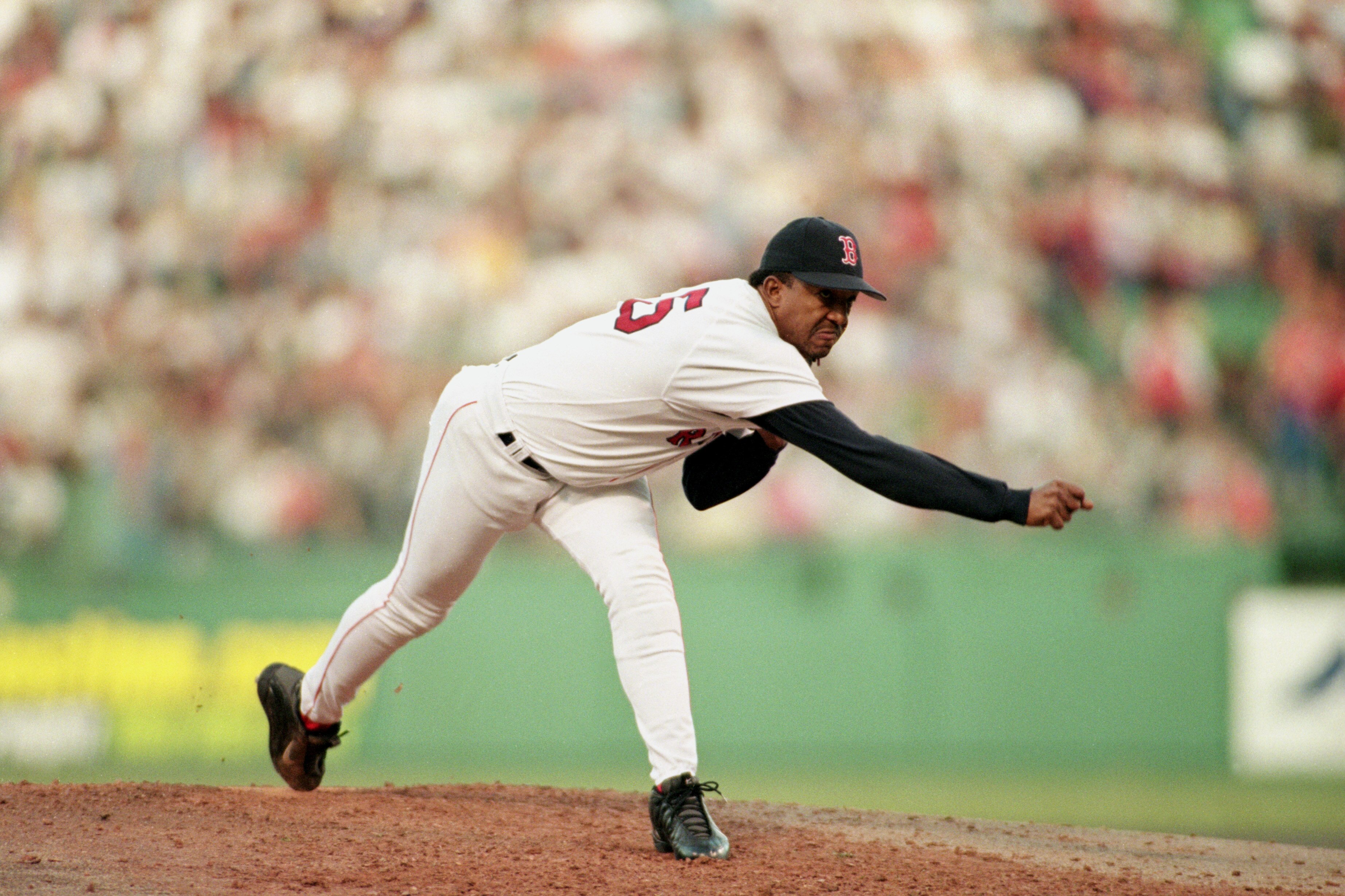 BOSTON - OCTOBER 16:  Pitcher Pedro Martinez #45 of the Boston Red Sox delivers a pitch against the New York Yankees during the game at Fenway Park in Boston, Massachusetts on October 16, 1999.  The Red Sox won 13-1.  (Photo by Jed Jacobsohn/Getty Images)