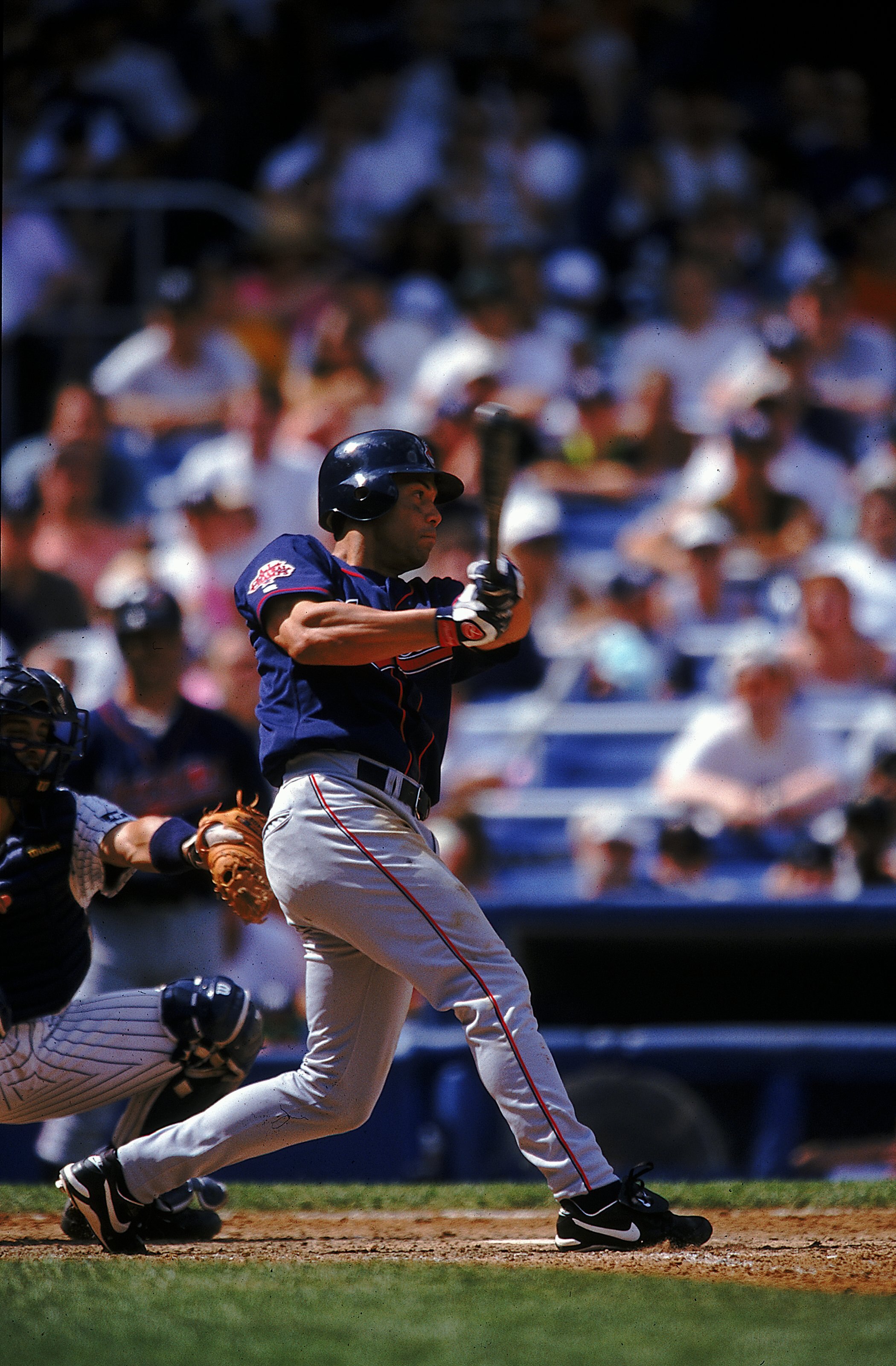 25 Jul 1999: Roberto Alomar #12 of the Cleveland Indians watches the ball after hitting it during the game against the New York Yankees at Yankee Stadium in the Bronx, New York. The Yankees defeated the Indians 2-1.