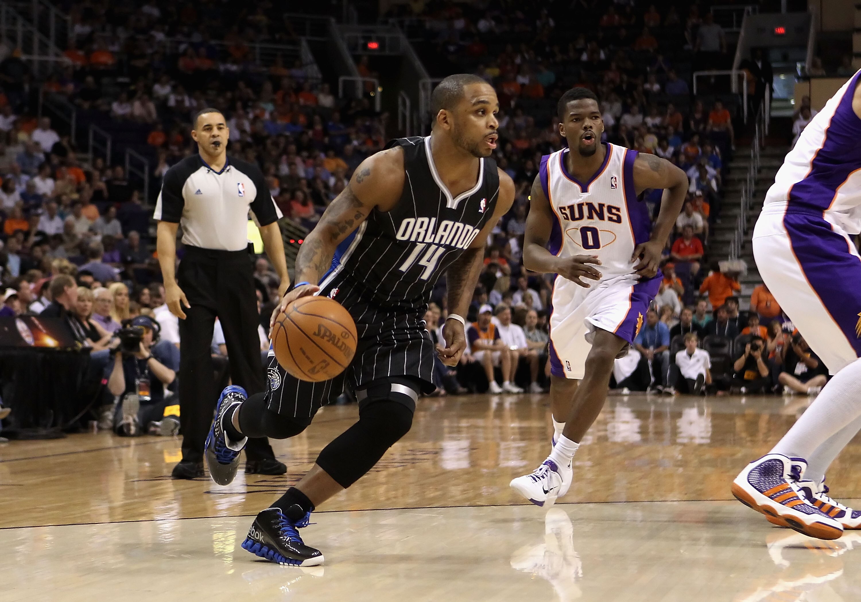 PHOENIX, AZ - MARCH 13:  Jameer Nelson #14 of the Orlando Magic handles the ball during the NBA game against the Phoenix Suns at US Airways Center on March 13, 2011 in Phoenix, Arizona. The Magic defeated the Suns 111-88. NOTE TO USER: User expressly ackn