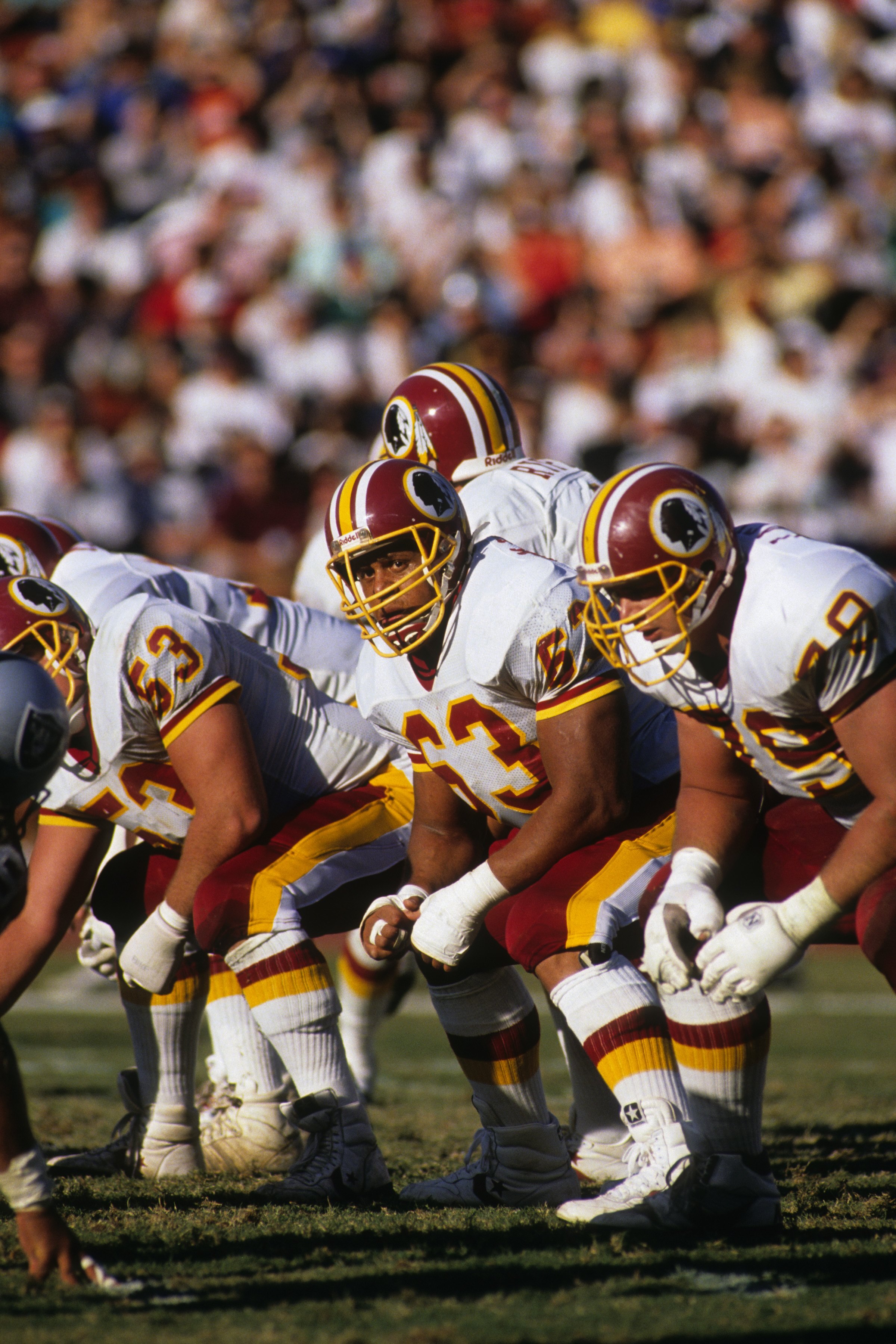 WASHINGTON - OCTOBER 29:  Tackle Raleigh McKenzie #63 of the Washington Redskins lines up on the line of scrimage during the game against the Los Angeles Raiders at RFK Stadium on October 29, 1989 in Washington, D.C.  The Raiders won 37-24.  (Photo by Geo