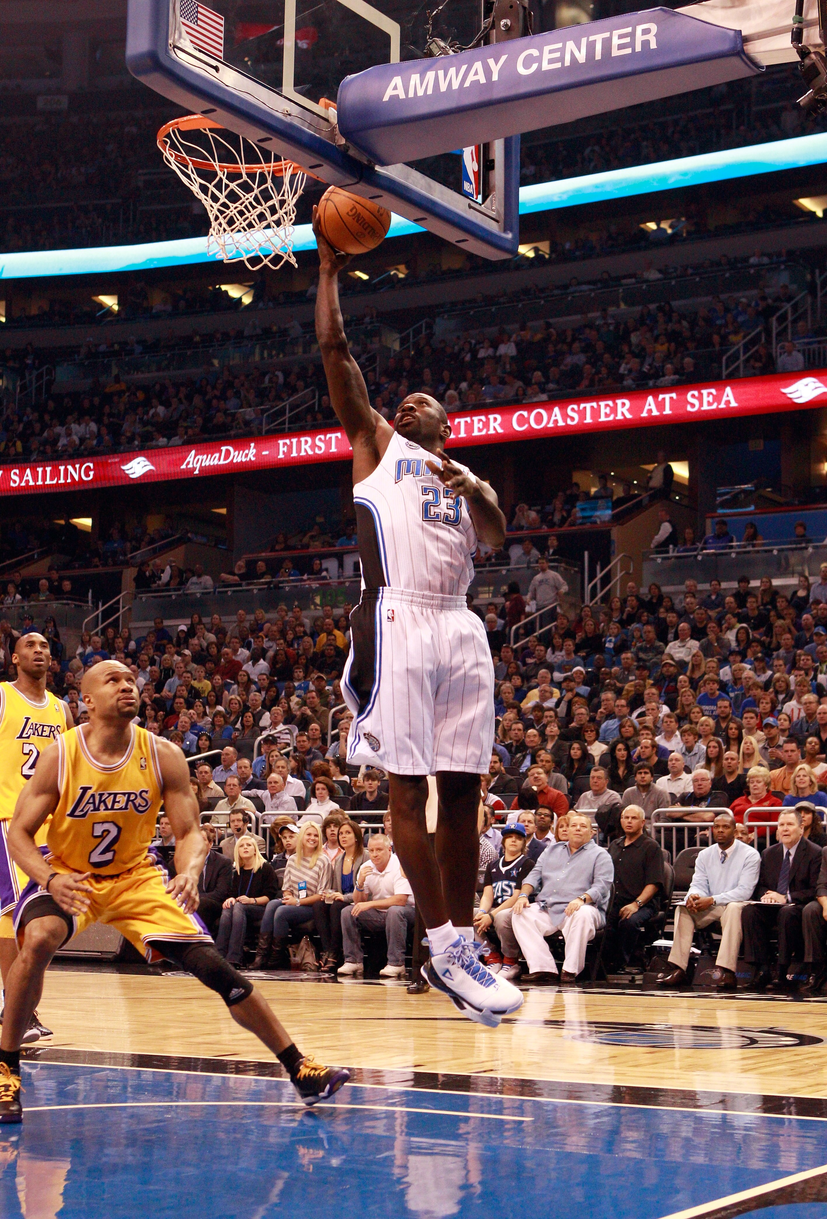 ORLANDO, FL - FEBRUARY 13:  Jason Richardson #23 of the Orlando Magic attempts a shot over Derek Fisher #2 of the Los Angeles Lakers during the game at Amway Arena on February 13, 2011 in Orlando, Florida.  NOTE TO USER: User expressly acknowledges and ag