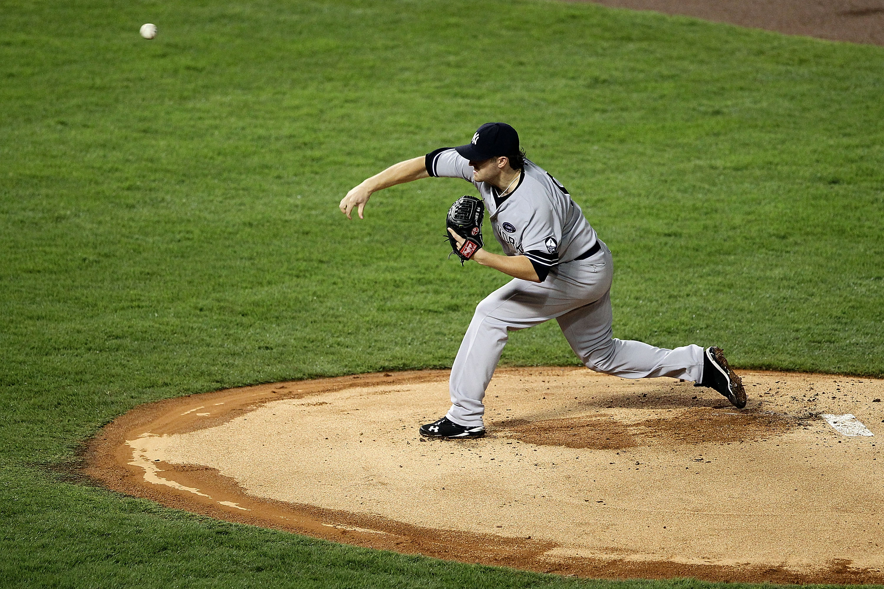 ARLINGTON, TX - OCTOBER 22:  Phil Hughes #65 of the New York Yankees throws a pitch against the Texas Rangers in Game Six of the ALCS during the 2010 MLB Playoffs at Rangers Ballpark in Arlington on October 22, 2010 in Arlington, Texas.  (Photo by Ronald