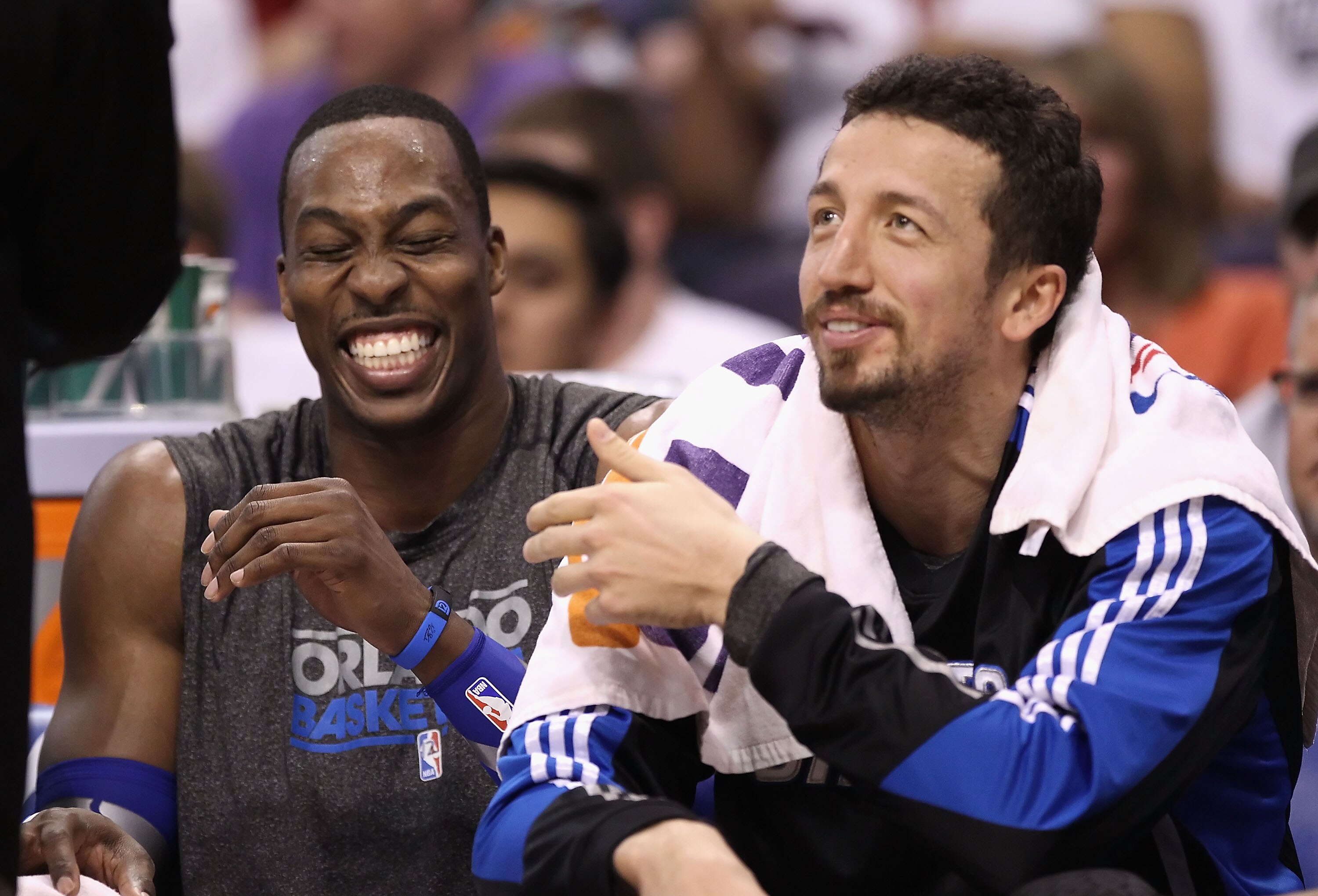 PHOENIX, AZ - MARCH 13:  Dwight Howard #12 and Hedo Turkoglu #15 of the Orlando Magic laugh on the bench during the NBA game against the Phoenix Suns at US Airways Center on March 13, 2011 in Phoenix, Arizona. The Magic defeated the Suns 111-88.  NOTE TO