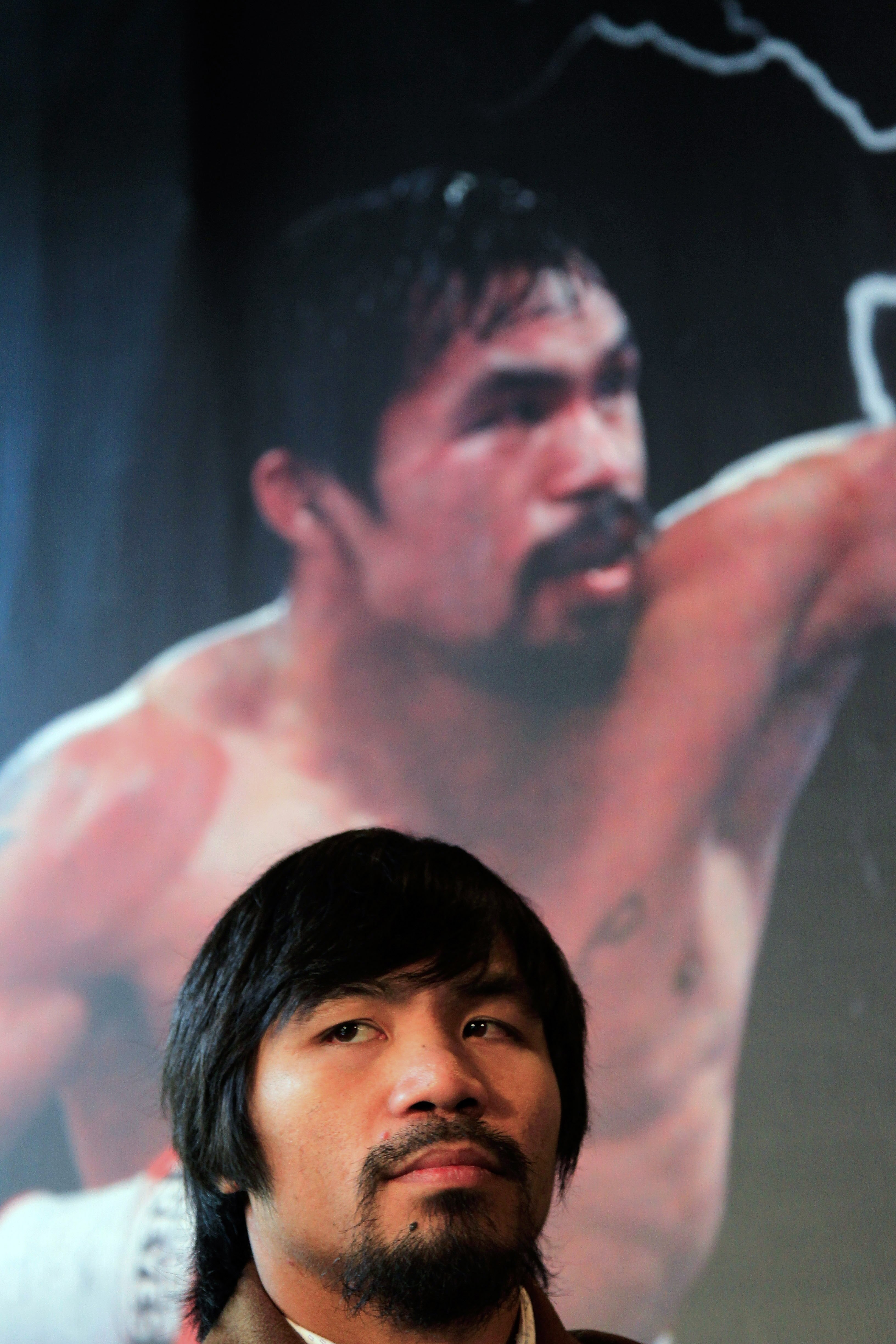 NEW YORK, NY - FEBRUARY 14:  Manny Pacquiao looks on at a press conference to promote his upcoming fight with Shane Mosley at The Lighthouse at Chelsea Piers on February 14, 2011 in New York City.  (Photo by Chris Trotman/Getty Images)
