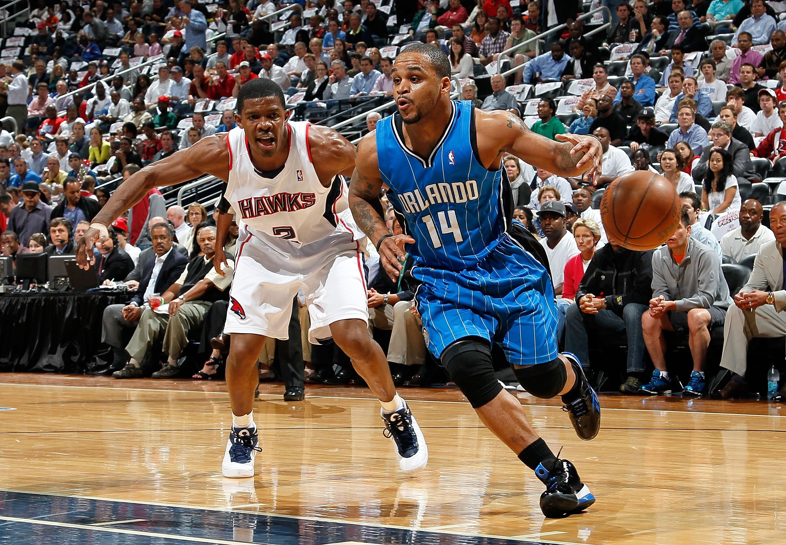 ATLANTA - MAY 10:  Jameer Nelson #14 of the Orlando Magic against Joe Johnson #2 of the Atlanta Hawks during Game Four of the Eastern Conference Semifinals of the 2010 NBA Playoffs at Philips Arena on May 10, 2010 in Atlanta, Georgia.  NOTE TO USER: User