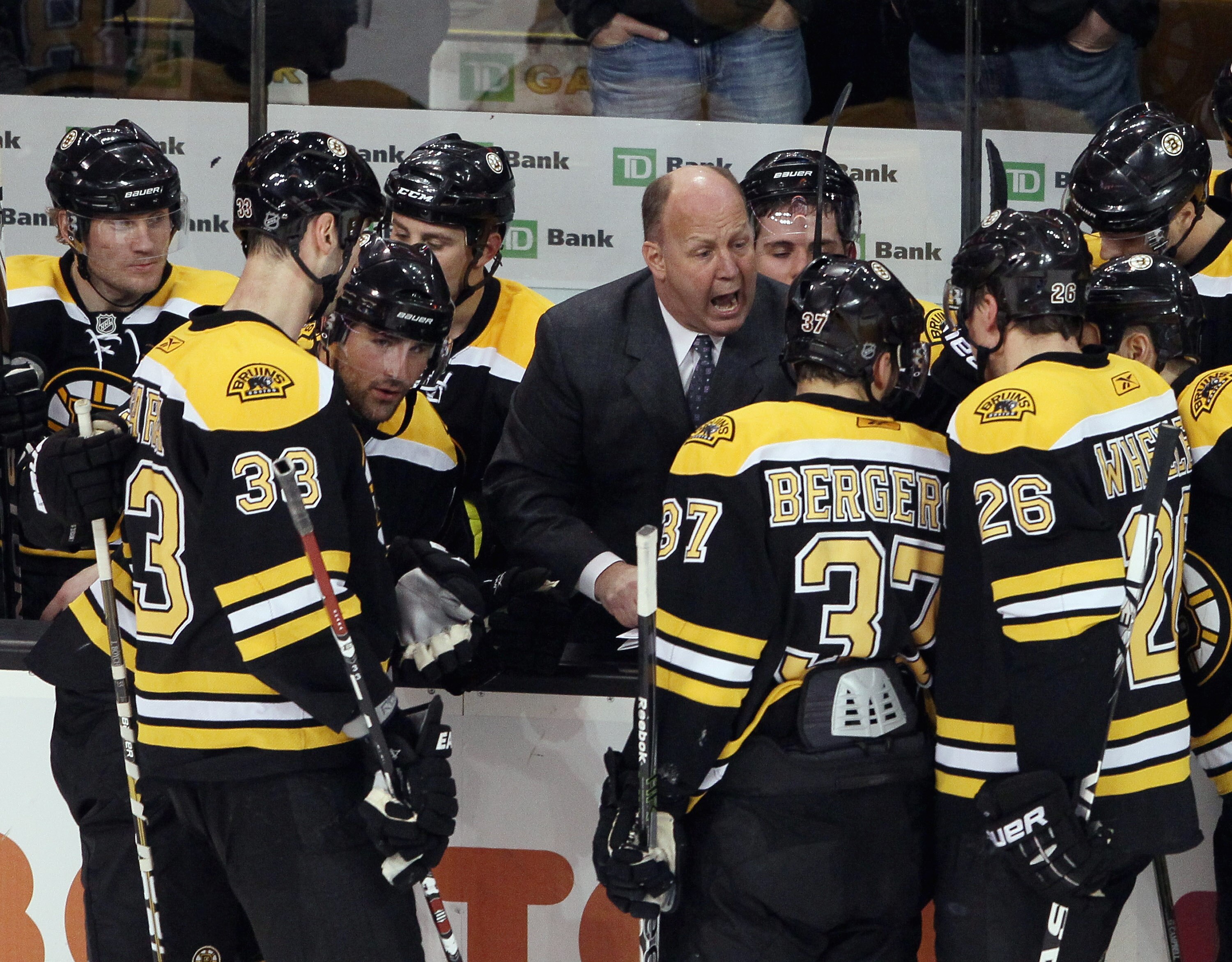 BOSTON, MA - JANUARY 13:  Head coach Claude Julien of the Boston Bruins talks with his players during a time out in the third period against the Philadelphia Flyers on January 13, 2011 at the TD Garden in Boston, Massachusetts. The Bruins defeated the Fly