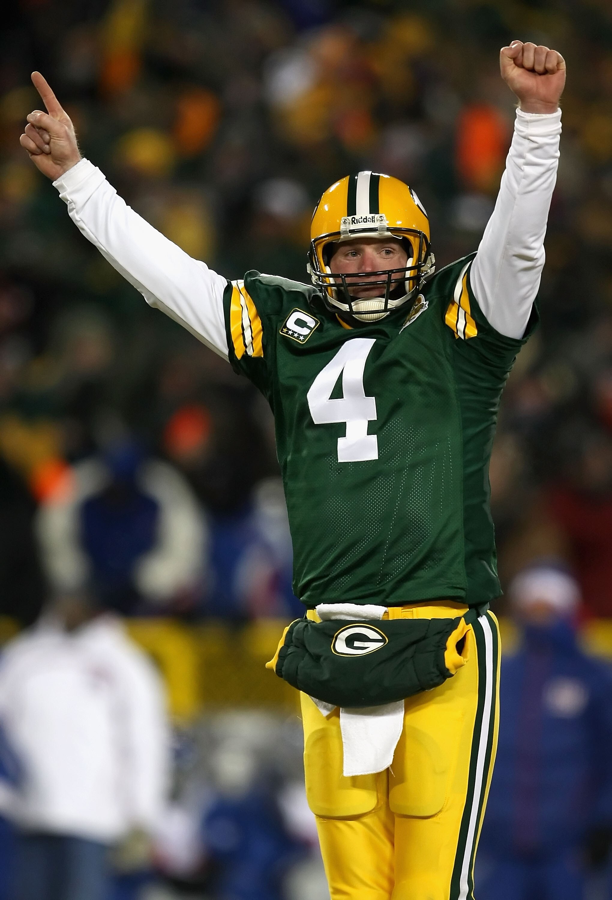 GREEN BAY, WI - JANUARY 20:  Quarterback Brett Favre #4 of the Green Bay Packers celebrates after throwing a 12 yard touchdown recption during the third quarter of the NFC championship game against the New York Giants on January 20, 2008 at Lambeau Field