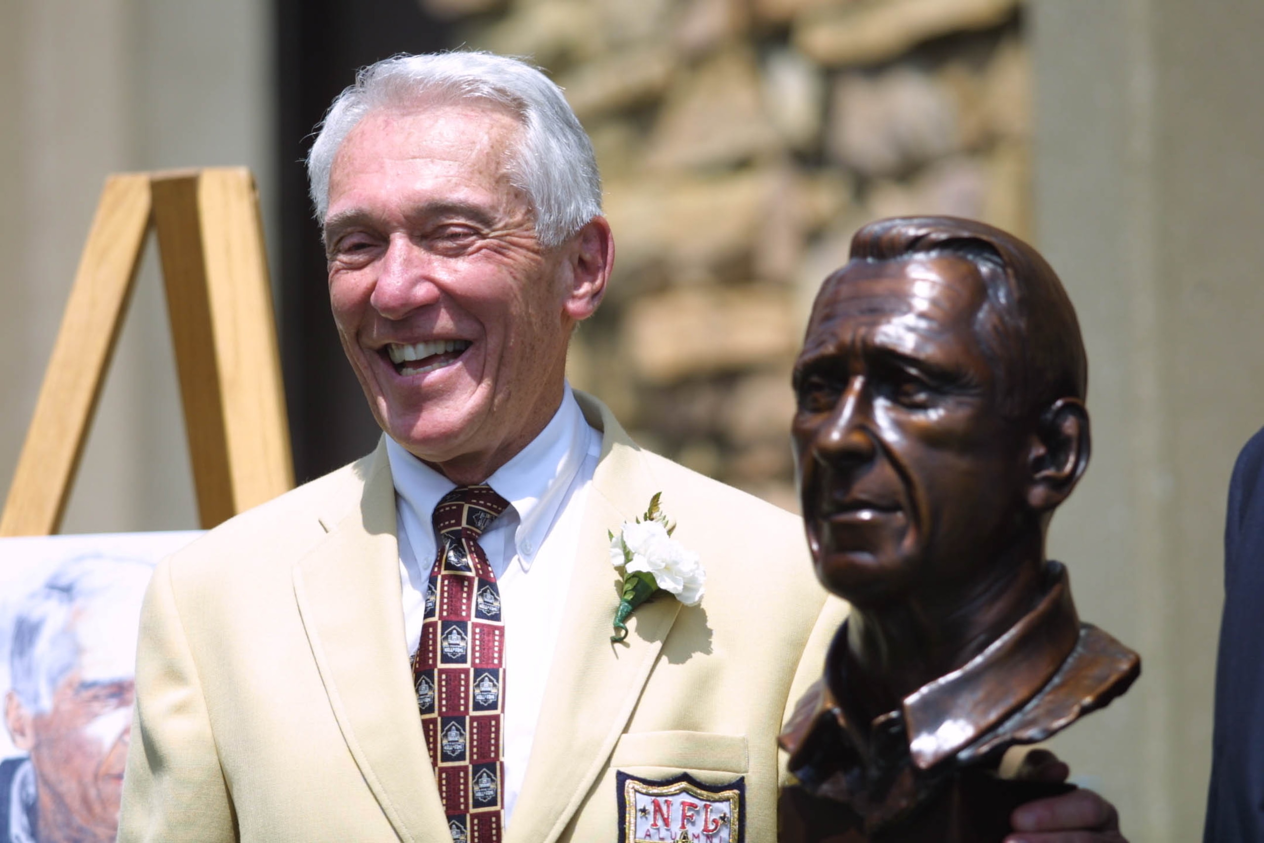 04 Aug 2001 : Marv Levy smiles as he poses next to his bust during the 2001 Pro Football Hall Of Fame Induction Ceremony at Hall's Game Day Theater in Canton, Ohio. DIGITAL IMAGE. Mandatory Credit: Tom Pidgeon/Allsport
