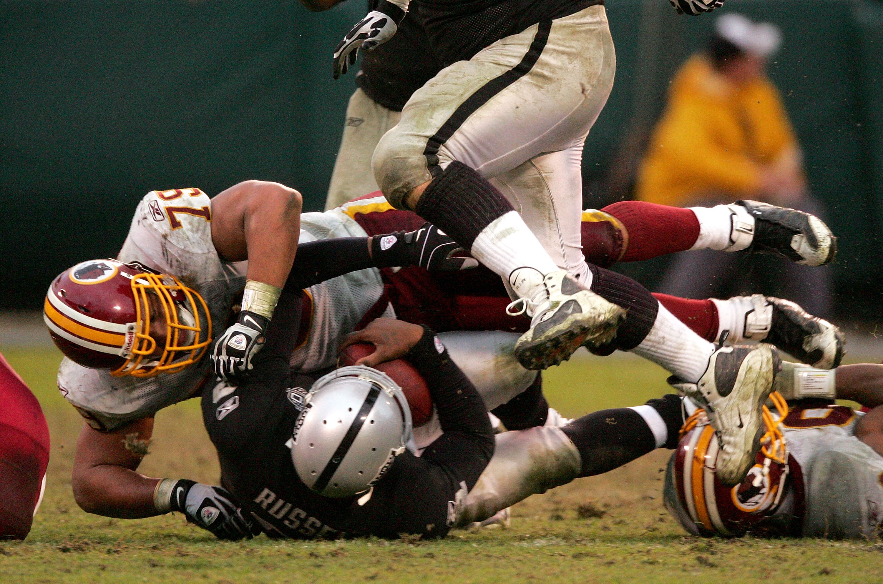 OAKLAND, CA - DECEMBER 13:  Lorenzo Alexander #79 of the Washington Redskins sacks JaMarcus Russell #2 of the Oakland Raiders at Oakland-Alameda County Coliseum on December 13, 2009 in Oakland, California.  (Photo by Ezra Shaw/Getty Images)