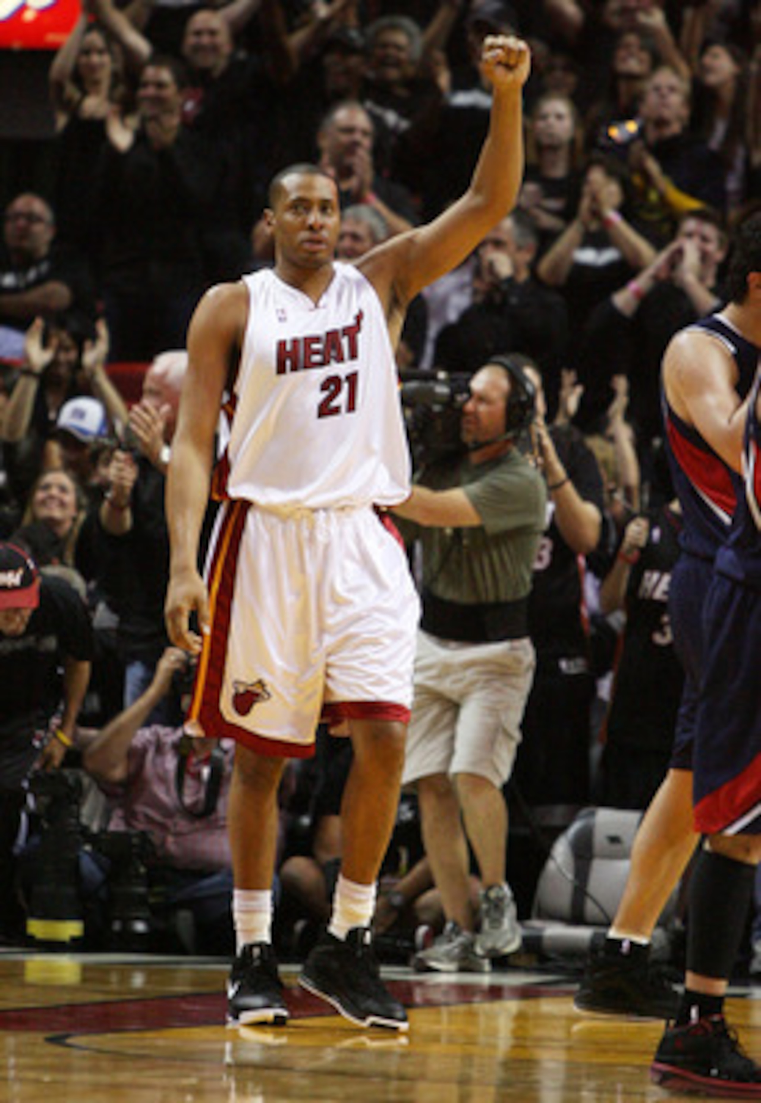 MIAMI - APRIL 25:  Jamaal Magloire #21 of the Miami Heat celebrates after the Heat take a 21 point lead at half-time against the Atlanta Hawks during Game Three of the Eastern Conference Quarterfinals at American Airlines Arena on April 25, 2009 in Miami,