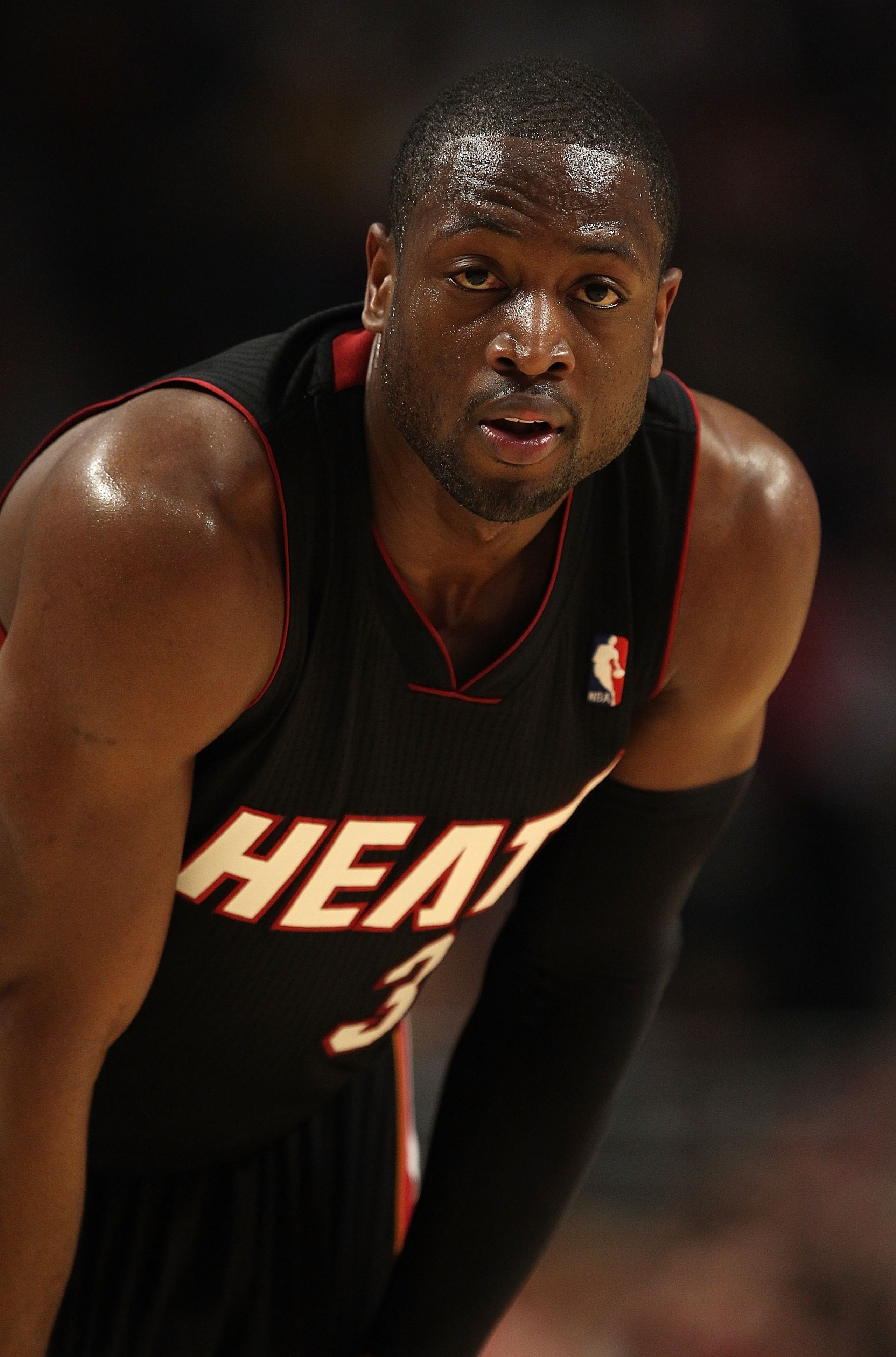 CHICAGO, IL - FEBRUARY 24: Dwyane Wade #3 of the Miami Heat waits as a member of the Chicago Bulls shoot a free-throw at the United Center on February 24, 2011 in Chicago, Illinois. The Bulls defeated the Heat 93-89. NOTE TO USER: User expressly acknowled
