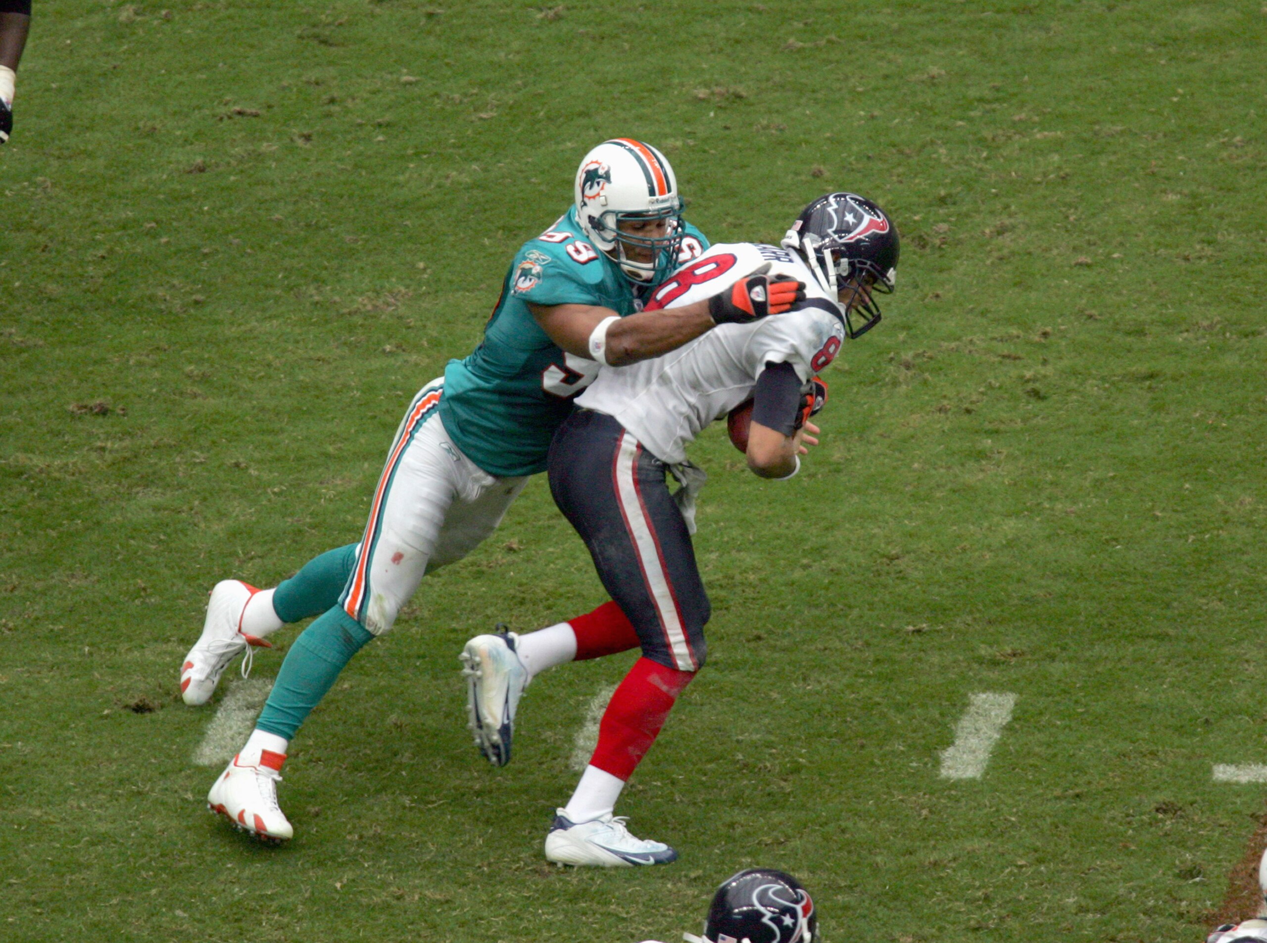 HOUSTON -OCTOBER 1:  Jason Taylor #88 of the Miami Dolphins sacks quarterback David Carr #8 of the Houston Texans at Reliant Stadium on October 1, 2006 in Houston, Texas. (Photo by Ronald Martinez/Getty Images)