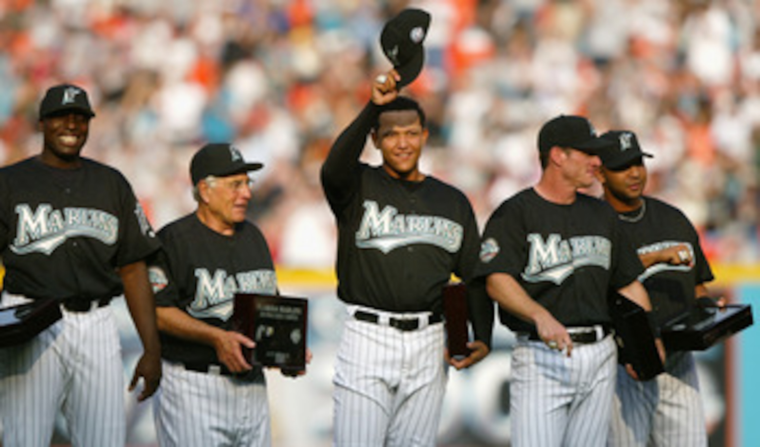 MIAMI - APRIL 10:  (L-R) Dontrelle Willis #35, Manager Jack McKeon #15, Miguel Cabrera #24, Jeff Conine #18 and Alex Gonzalez #11 of the Florida Marlins smile and acknowledge the fans after receiving their 2003 World Series Championship rings prior to the