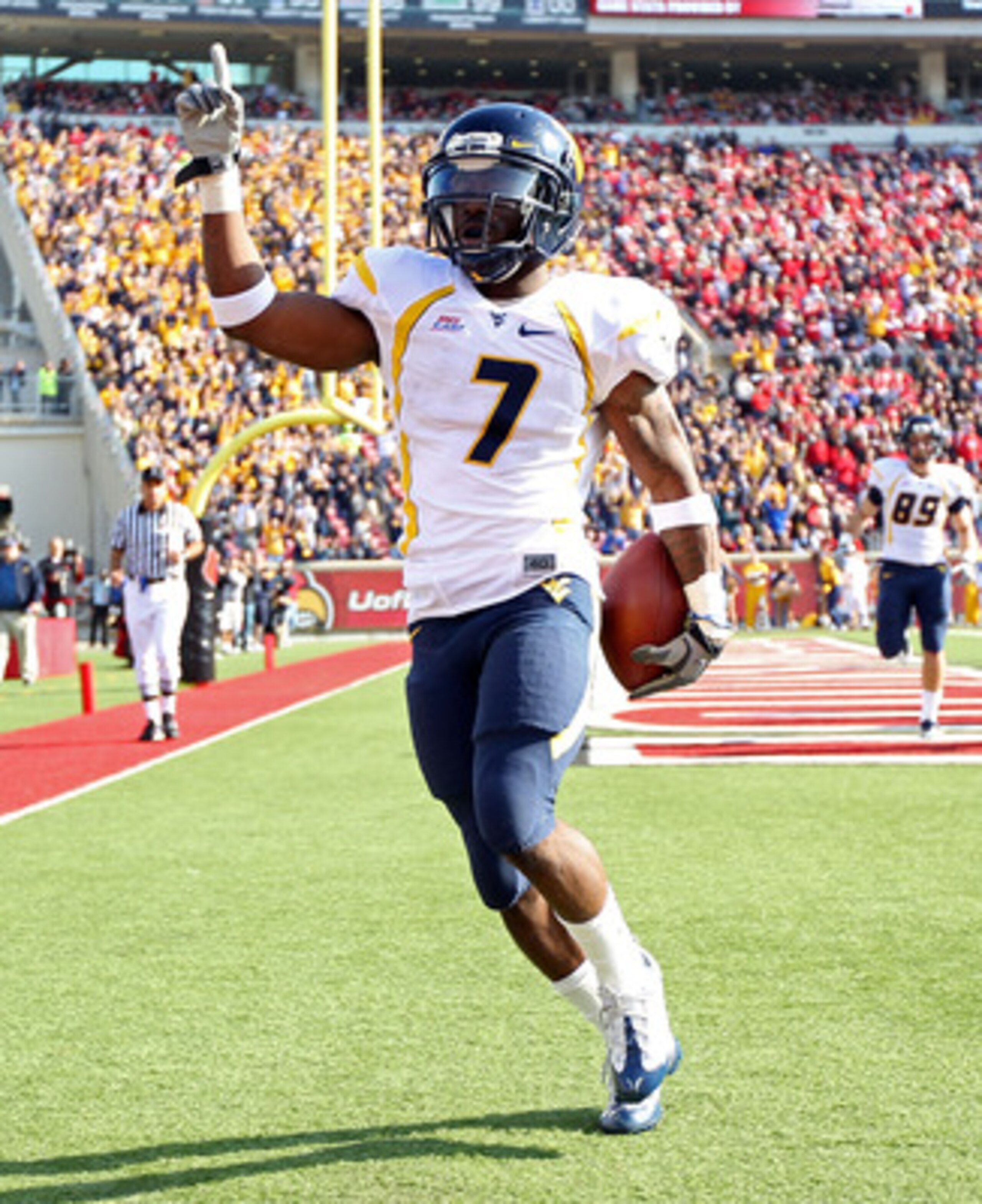 LOUISVILLE, KY - NOVEMBER 20: Noel Devine #7 of the West Virginia Mountaineers celebrates after runing for a touchdown during the Big East Conference game against the Louisville Cardinals at Papa John's Cardinal Stadium on November 20, 2010 in Louisville LOUISVILLE, KY - NOVEMBER 20: Noel Devine #7 of the West Virginia Mountaineers celebrates after runing for a touchdown during the Big East Conference game against the Louisville Cardinals at Papa John's Cardinal Stadium on November 20, 2010 in Louisville
