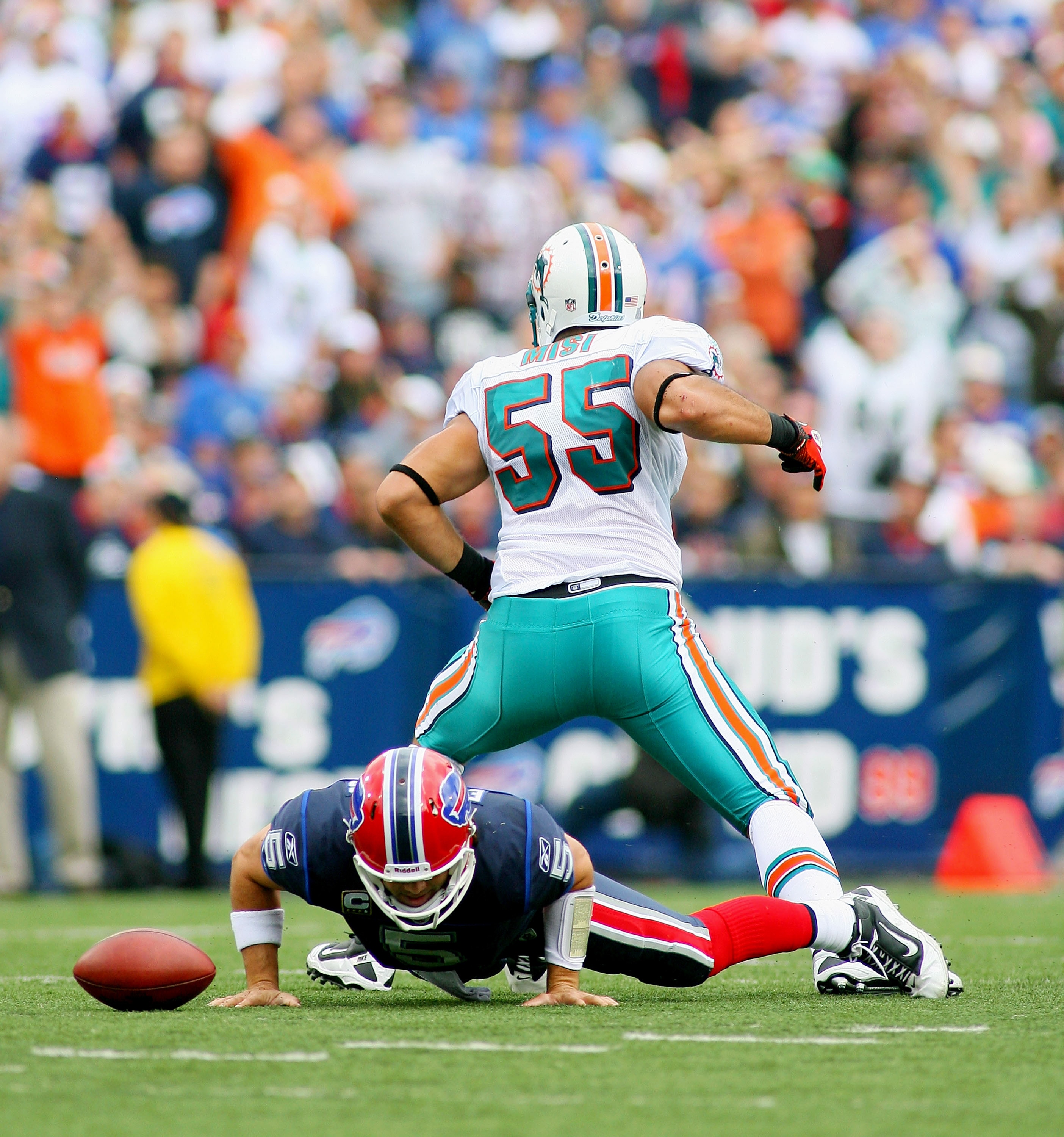 ORCHARD PARK, NY - SEPTEMBER 12: Koa Misi #55 of the Miami Dolphins celebrates his sack on Trent Edwards #5 of the Buffalo Bills  during the NFL season opener at Ralph Wilson Stadium on September 12, 2010 in Orchard Park, New York. Miami won 15-10. (Photo