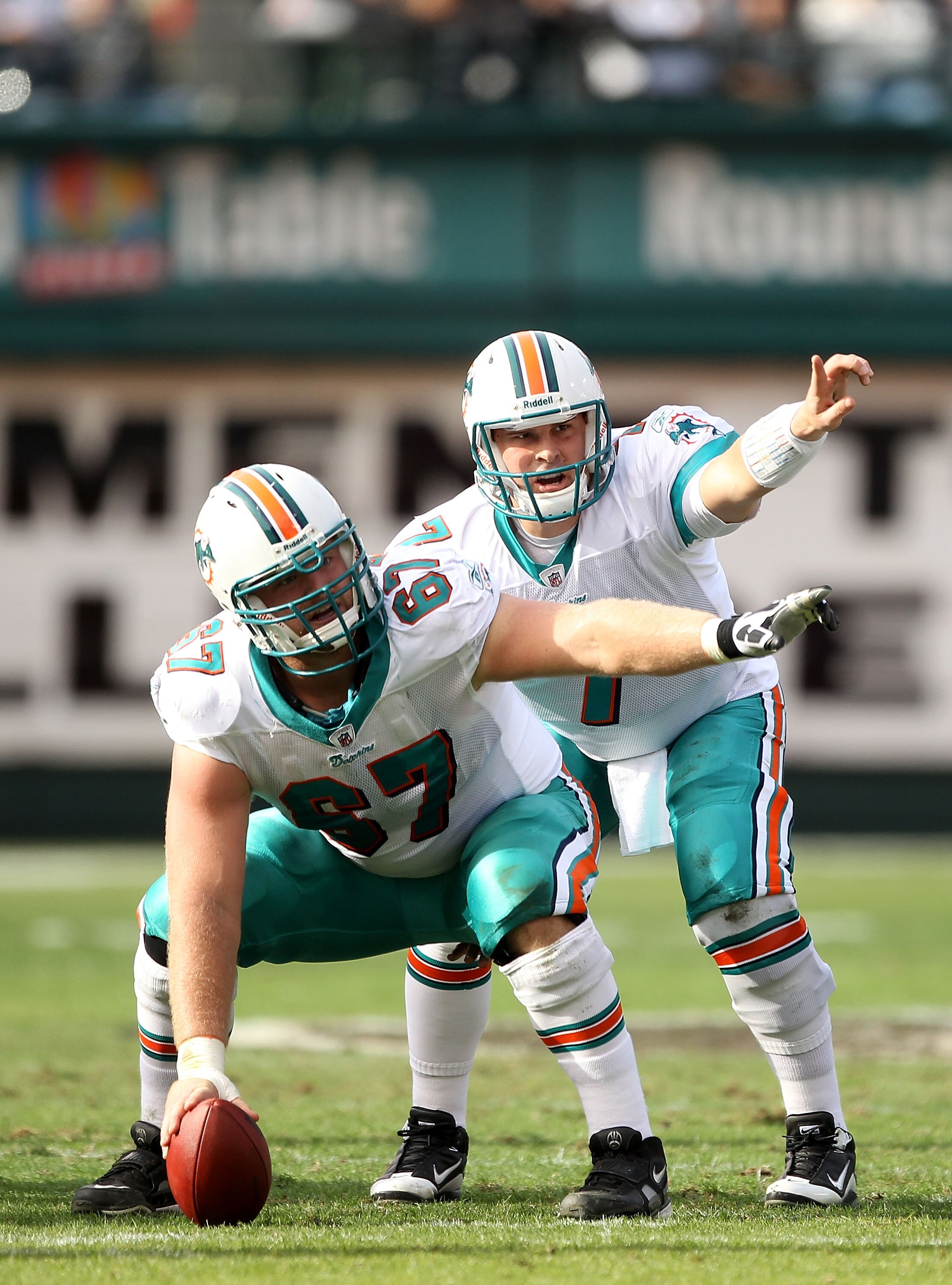 OAKLAND, CA - NOVEMBER 28:  Chad Henne #7 and Joe Berger #67 of the Miami Dolphins in action against the Oakland Raiders at Oakland-Alameda County Coliseum on November 28, 2010 in Oakland, California.  (Photo by Ezra Shaw/Getty Images)