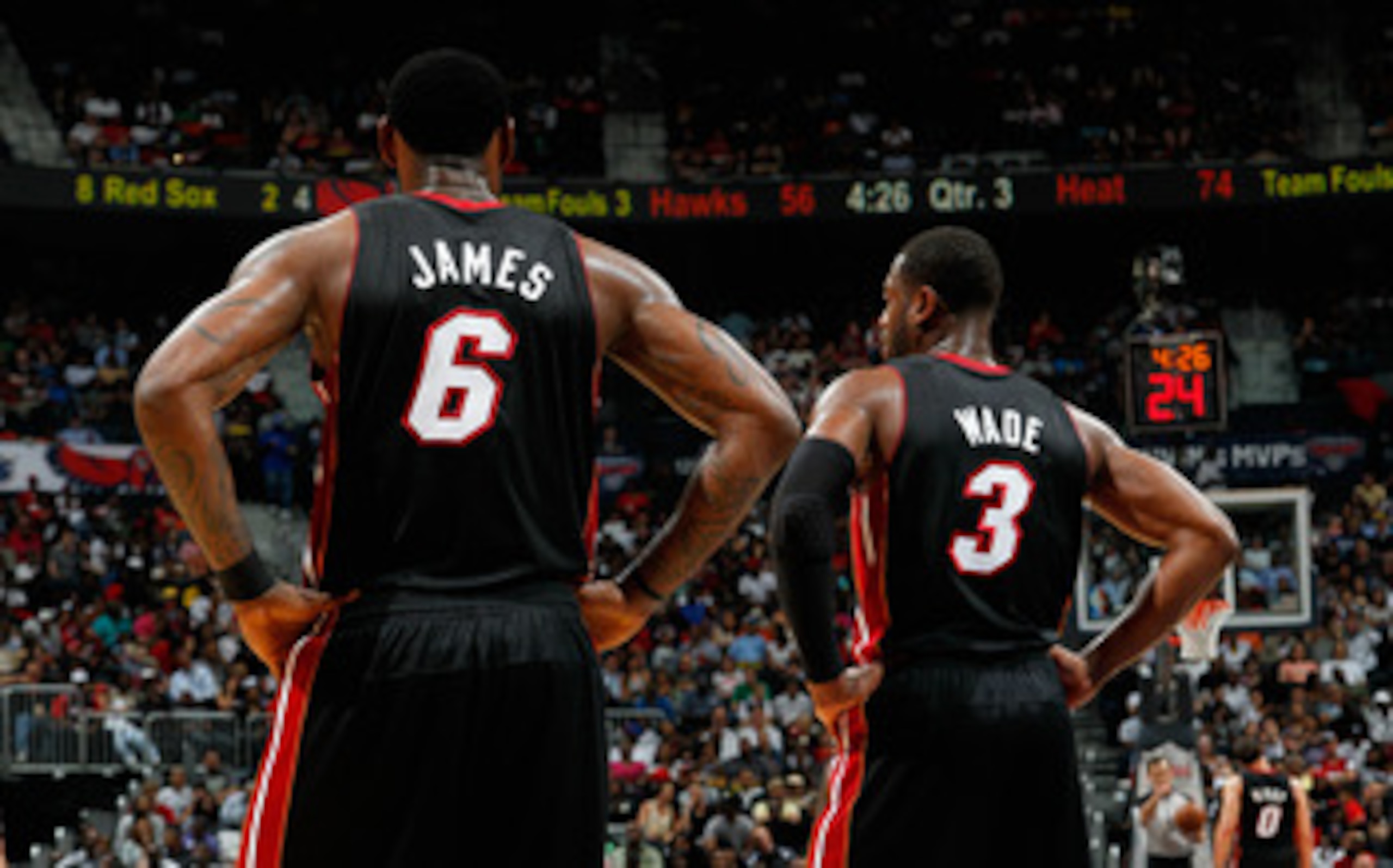 ATLANTA, GA - APRIL 11:  LeBron James #6 and Dwyane Wade #3 of the Miami Heat stand during a free throw against the Atlanta Hawks at Philips Arena on April 11, 2011 in Atlanta, Georgia.  NOTE TO USER: User expressly acknowledges and agrees that, by downlo