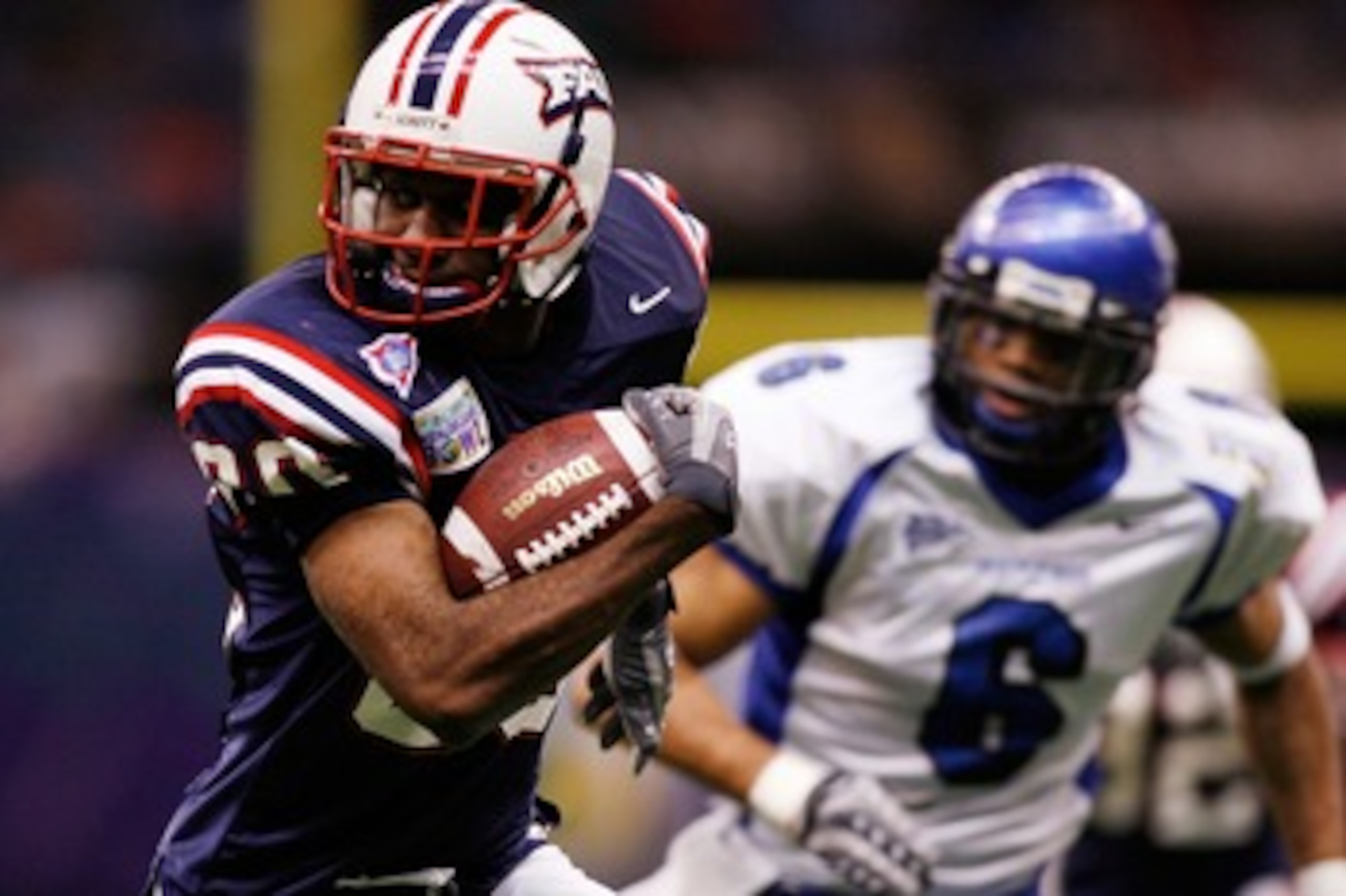 NEW ORLEANS - DECEMBER 21: Lester Jean #80 of the Florida Atlantic University Owls avoids a tackle by Dontae Reed #6 of the Memphis University Tigers in the New Orleans Bowl on December 21, 2007 at the Louisiana Superdome in New Orleans, Louisiana. The NEW ORLEANS - DECEMBER 21: Lester Jean #80 of the Florida Atlantic University Owls avoids a tackle by Dontae Reed #6 of the Memphis University Tigers in the New Orleans Bowl on December 21, 2007 at the Louisiana Superdome in New Orleans, Louisiana. The