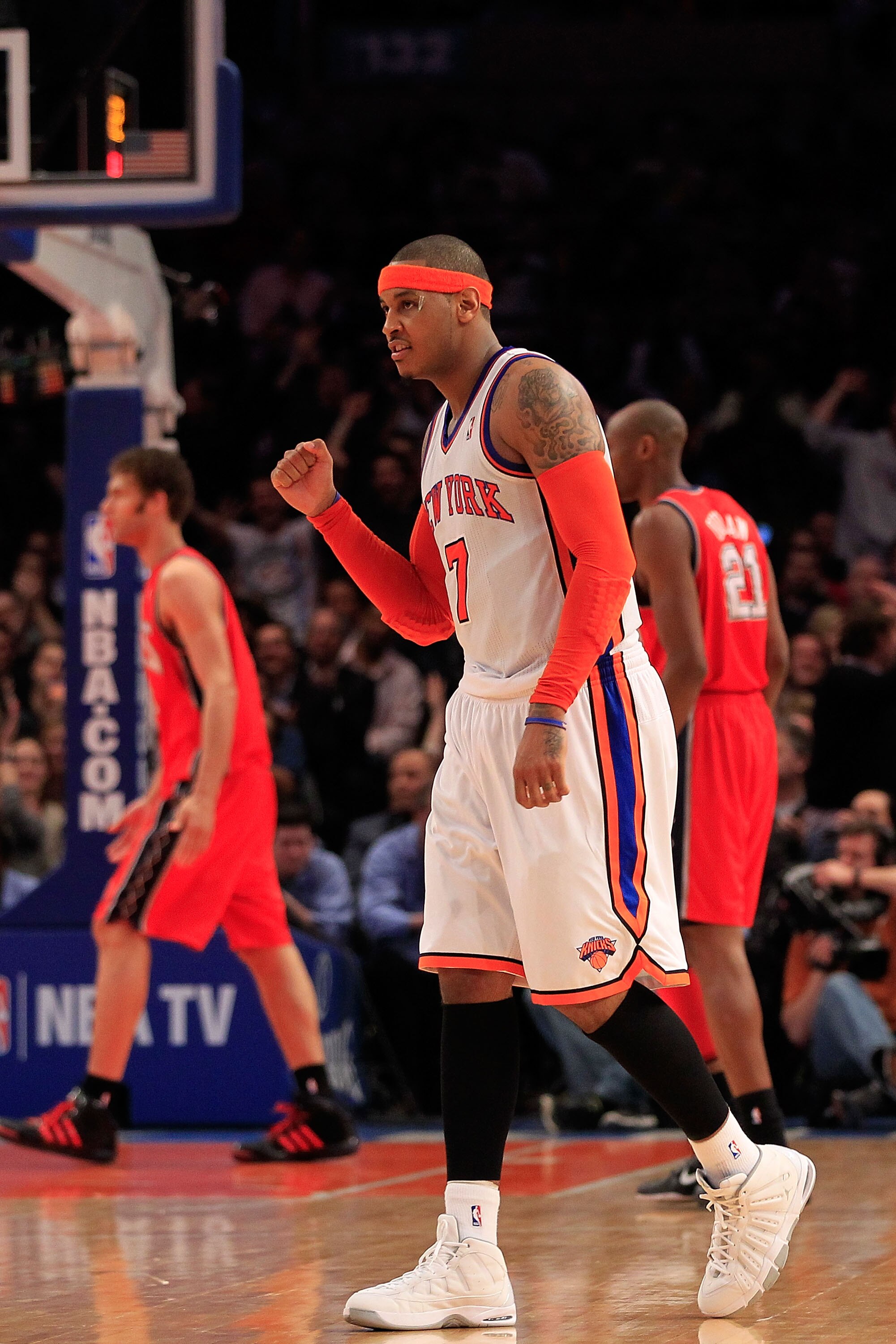 NEW YORK, NY - MARCH 30:  Carmelo Anthony #7 of the New York Knicks celebrates during the game against the New Jersey Nets at Madison Square Garden on March 30, 2011 in New York City. NOTE TO USER: User expressly acknowledges and agrees that, by downloadi