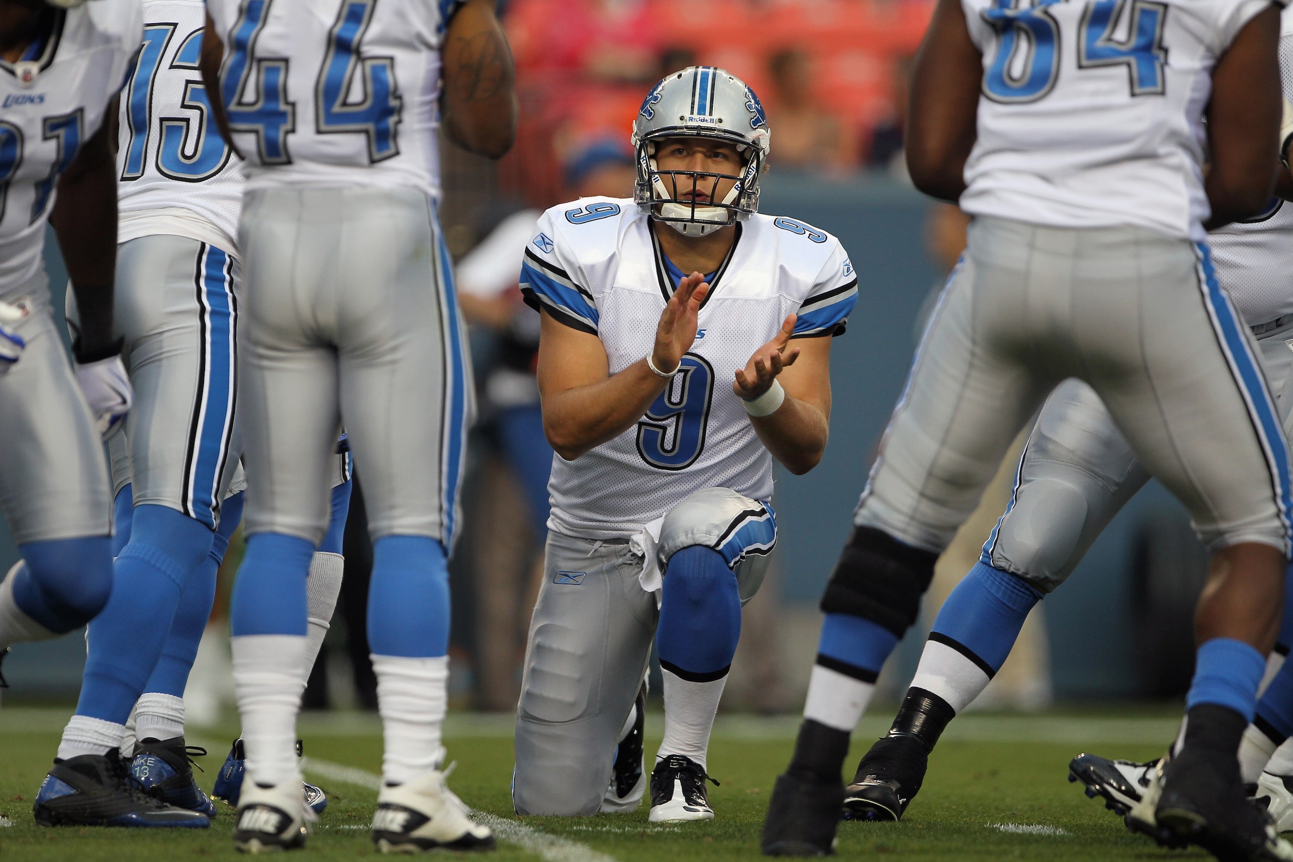 DENVER - AUGUST 21:  Quarterback Matthew Stafford #9 of the Detroit Lions runs the huddle against the Denver Broncos during preseason NFL action at INVESCO Field at Mile High on August 21, 2010 in Denver, Colorado. The Lions defeated the Broncos 25-20.  (