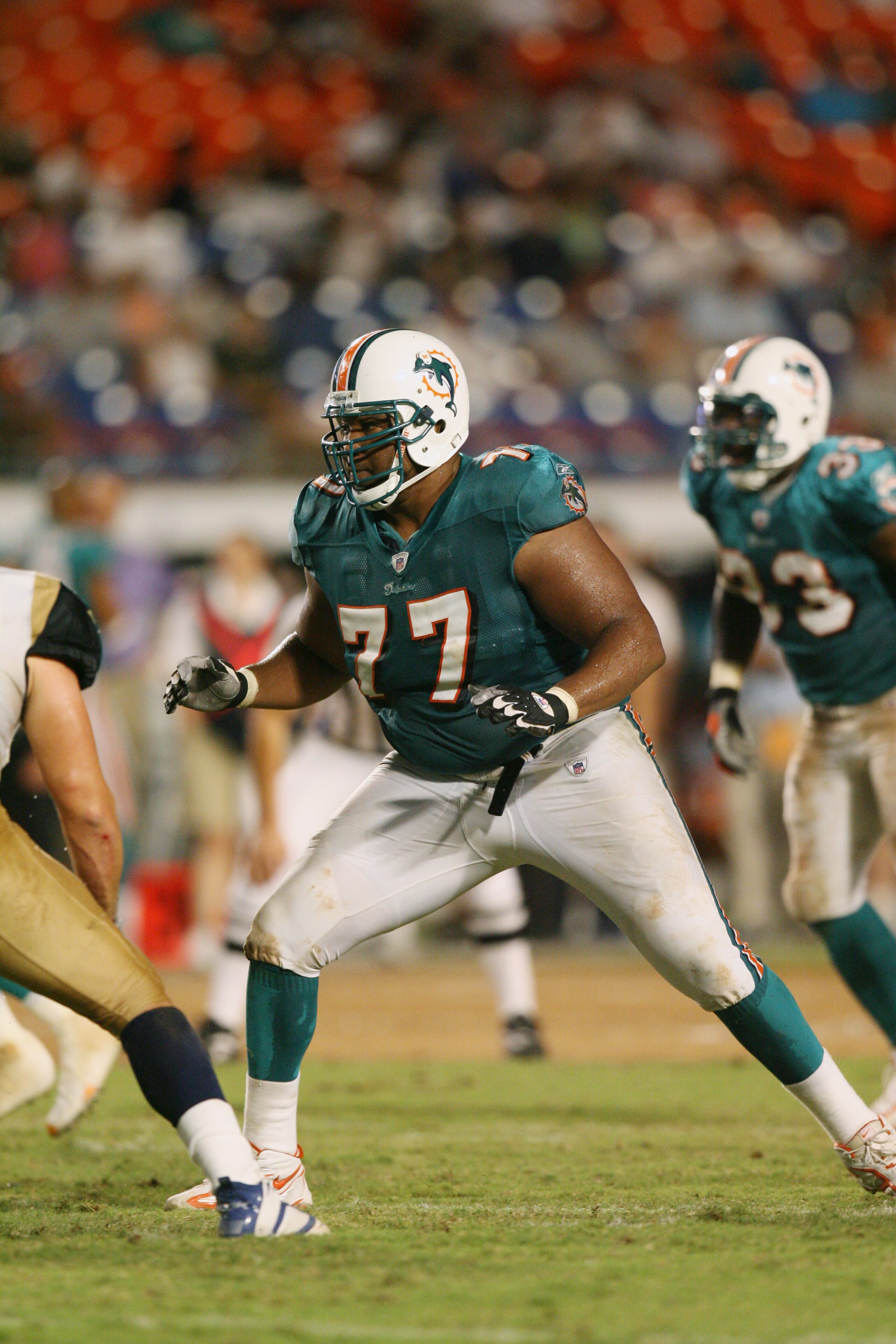 MIAMI - AUGUST 31: Tackle Damion McIntosh #77 of the Miami Dolphins blocks against the St. Louis Rams during the NFL game at Dolphin Stadium on August 31, 2006 in Miami, Florida. The Dolphins defeated the Rams 29-9. (Photo by Doug Benc/Getty Images) MIAMI - AUGUST 31: Tackle Damion McIntosh #77 of the Miami Dolphins blocks against the St. Louis Rams during the NFL game at Dolphin Stadium on August 31, 2006 in Miami, Florida. The Dolphins defeated the Rams 29-9. (Photo by Doug Benc/Getty Images)