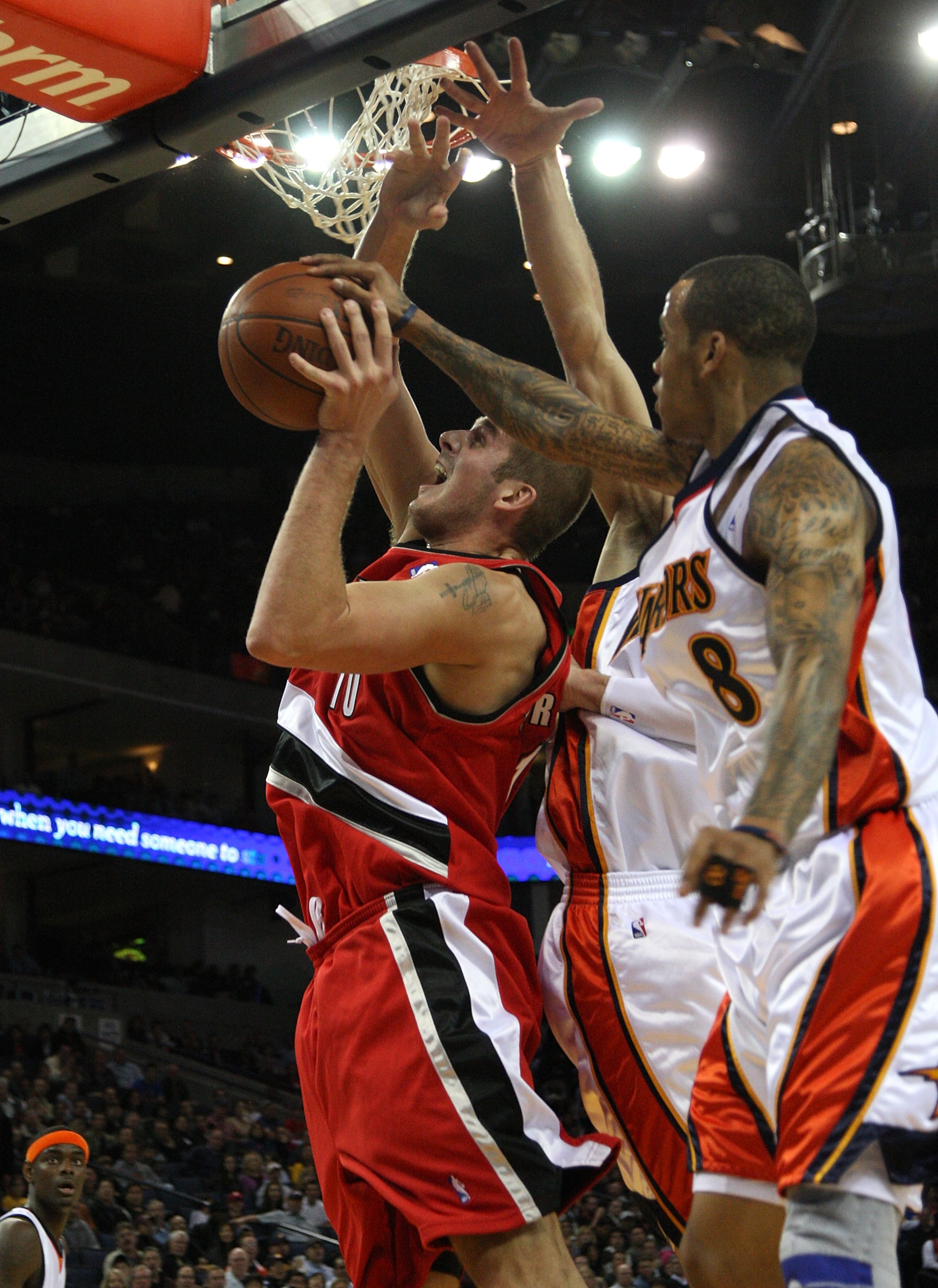 OAKLAND, CA - NOVEMBER 20:  Monta Ellis #8 of the Golden State Warriors defends against Joel Przybilla #10 of the Portland Trail Blazers during an NBA game at Oracle Arena on November 20, 2009 in Oakland, California.  (Photo by Jed Jacobsohn/Getty Images)