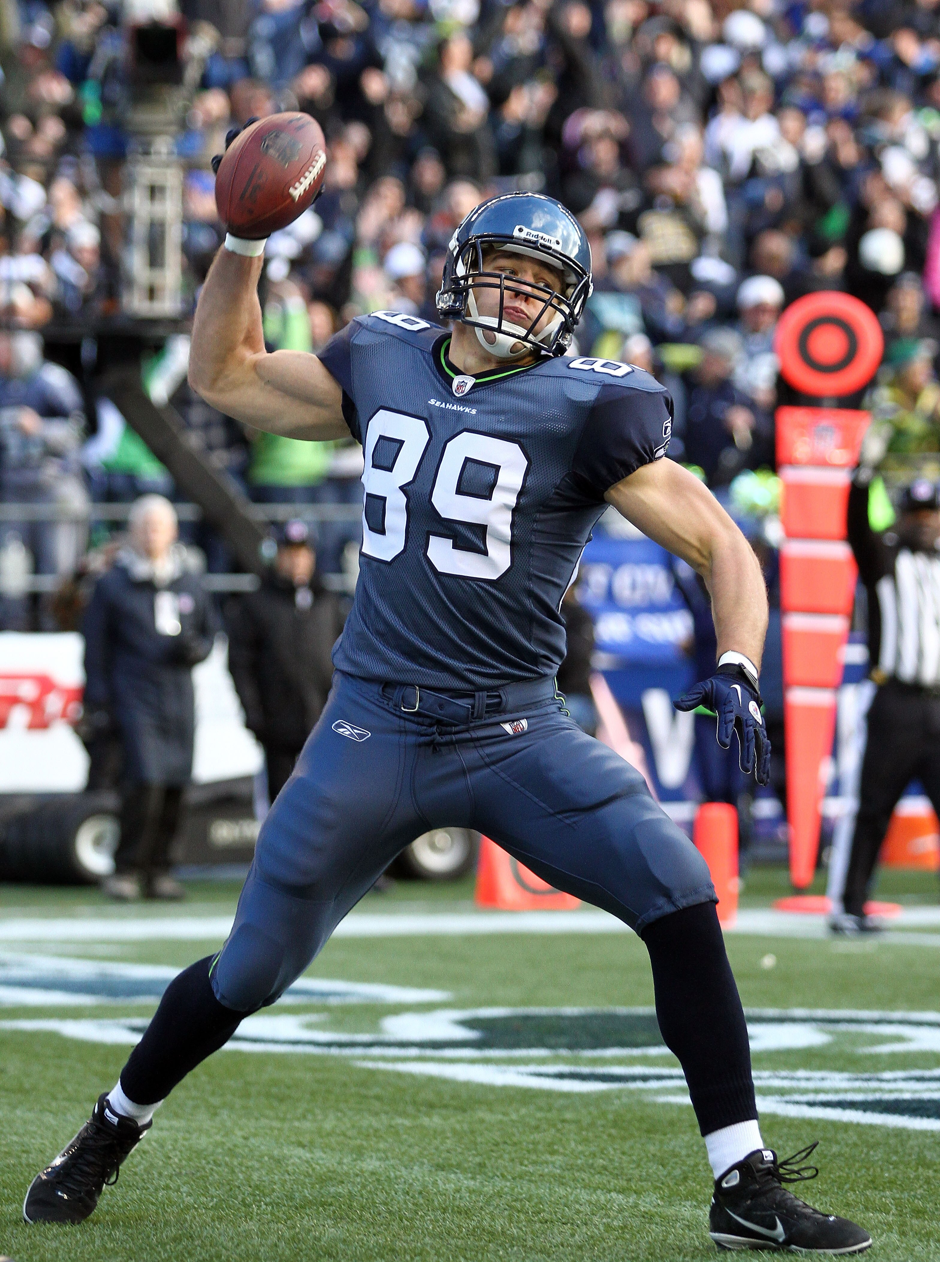 SEATTLE, WA - JANUARY 08:  Tight end John Carlson #89 of the Seattle Seahawks celebrates his 11-yard touchdown reception in the first quarter against the New Orleans Saints during the 2011 NFC wild-card playoff game at Qwest Field on January 8, 2011 in Se