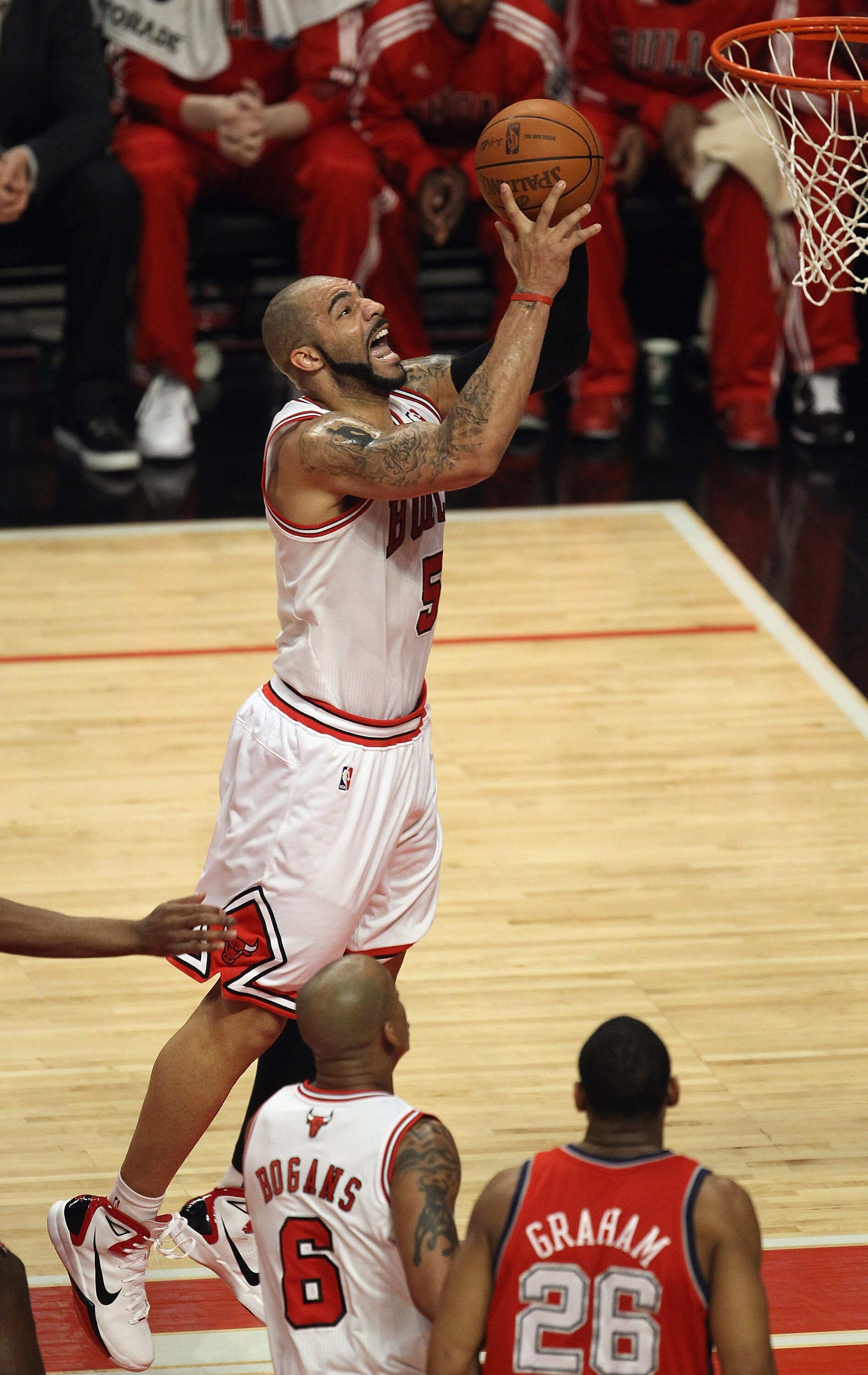 CHICAGO, IL - APRIL 13: Carlos Boozer #5 of the Chicago Bulls puts up a shot against the New Jersey Nets at the United Center on April 13, 2011 in Chicago, Illinois. The Bulls defeated the Nets 97-92. NOTE TO USER: User expressly acknowledges and agress t