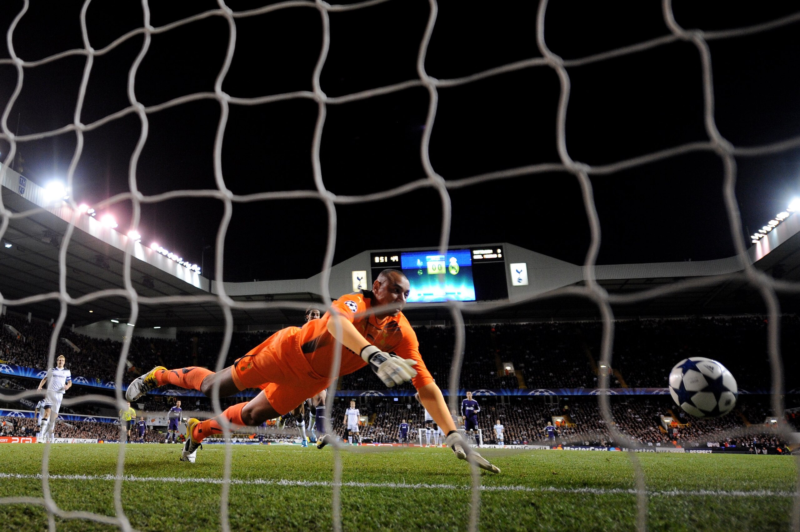 LONDON, ENGLAND - APRIL 13:  Goalkeeper Heurelho Gomes of Spurs can't stop Cristiano Ronaldo of Real Madrid scoring their first goal during the UEFA Champions League quarter final second leg match between Tottenham Hotspur and Real Madrid at White Hart La