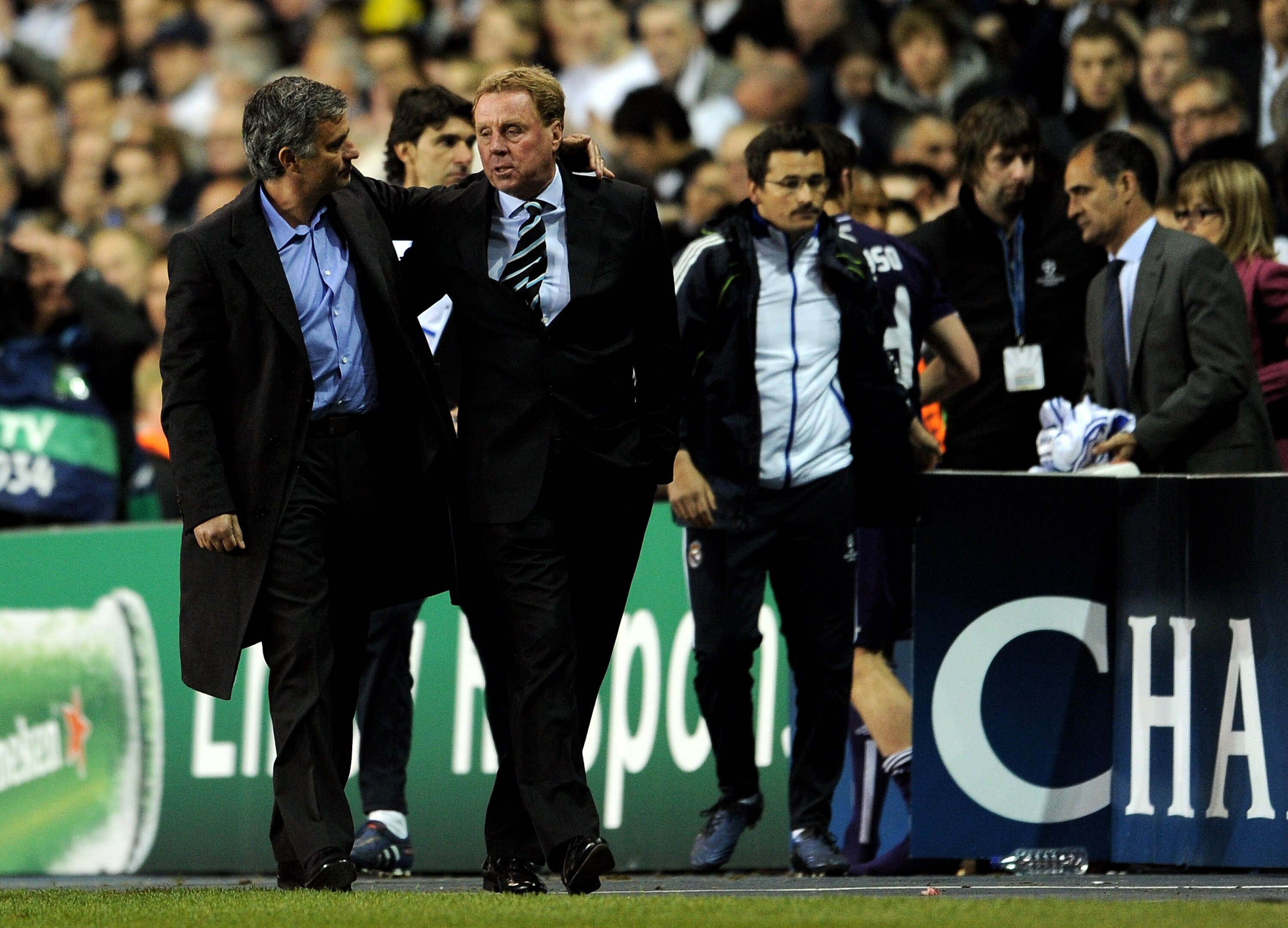 LONDON, ENGLAND - APRIL 13:  Manager Jose Mourinho speaks to Harry Redknapp of Spurs during the UEFA Champions League quarter final second leg match between Tottenham Hotspur and Real Madrid at White Hart Lane on April 13, 2011 in London, England.  (Photo