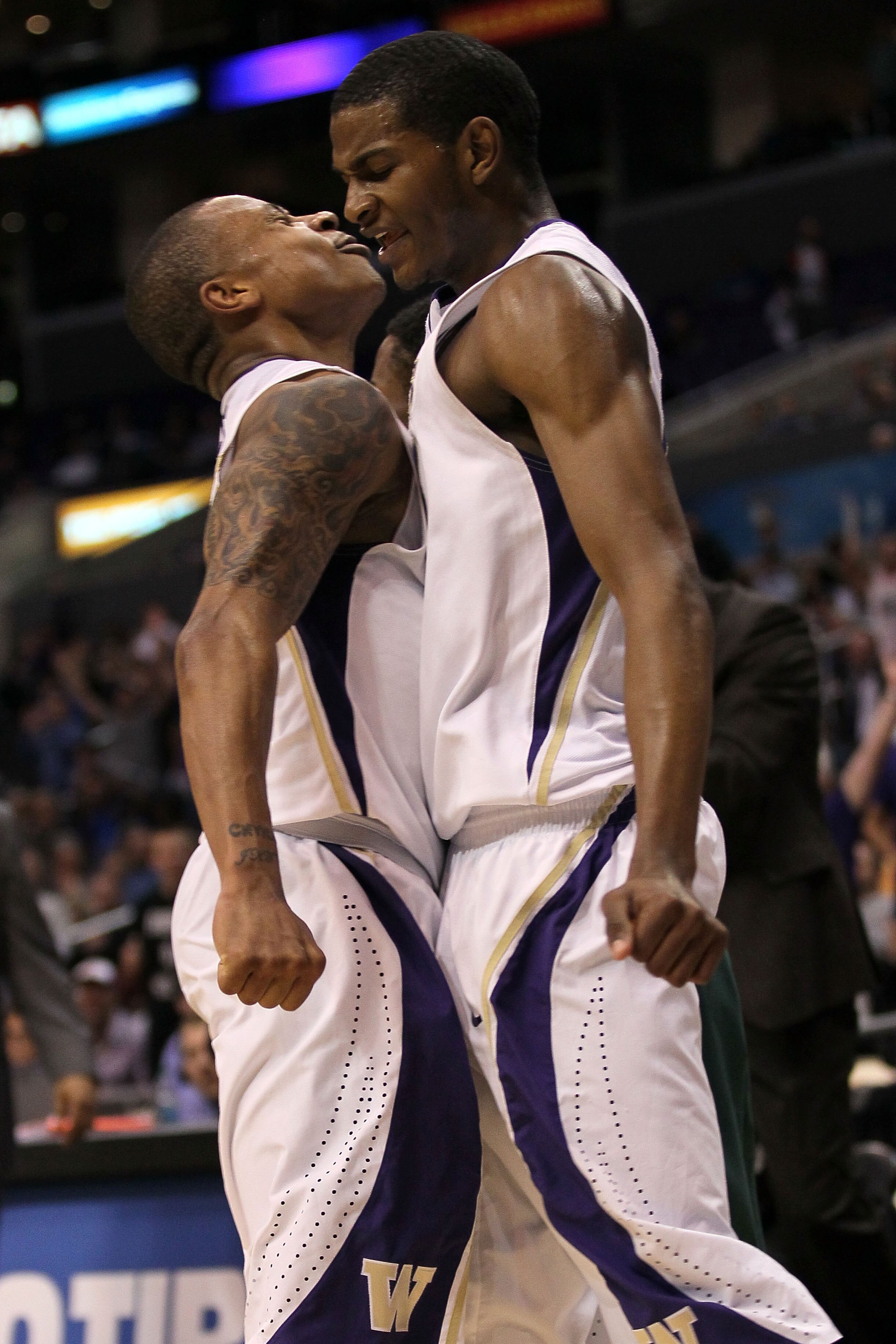 LOS ANGELES, CA - MARCH 11:  Isaiah Thomas #2 and C.J. Wilcox #23 of the Washington Huskies celebrate late in the second half while taking on the Oregon Ducks in the semifinals of the 2011 Pacific Life Pac-10 Men's Basketball Tournament at Staples Center