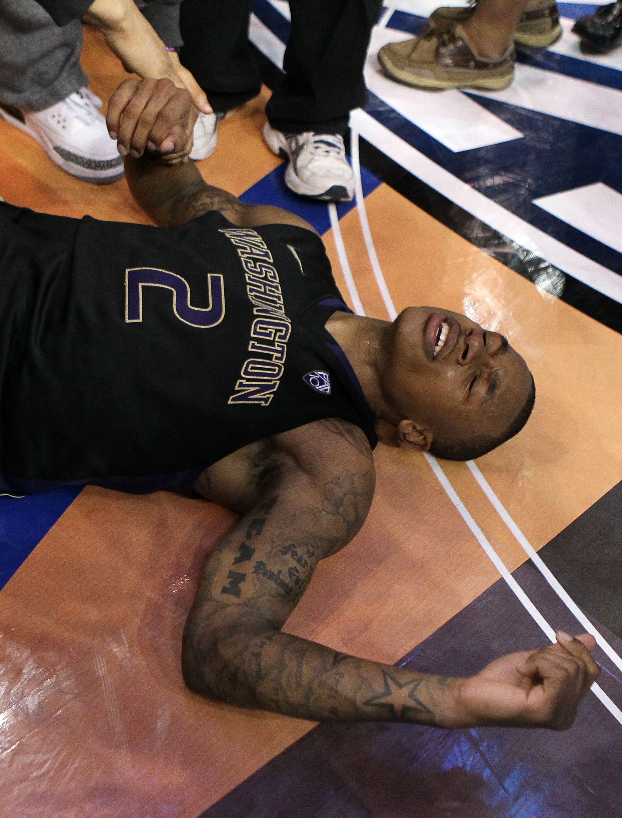 LOS ANGELES, CA - MARCH 12:  Isaiah Thomas #2 of the Washington Huskies reacts after making a last-second shot in overtime to defeat the Arizona Wildcats 77-75 in the championship game of the 2011 Pacific Life Pac-10 Men's Basketball Tournament at Staples