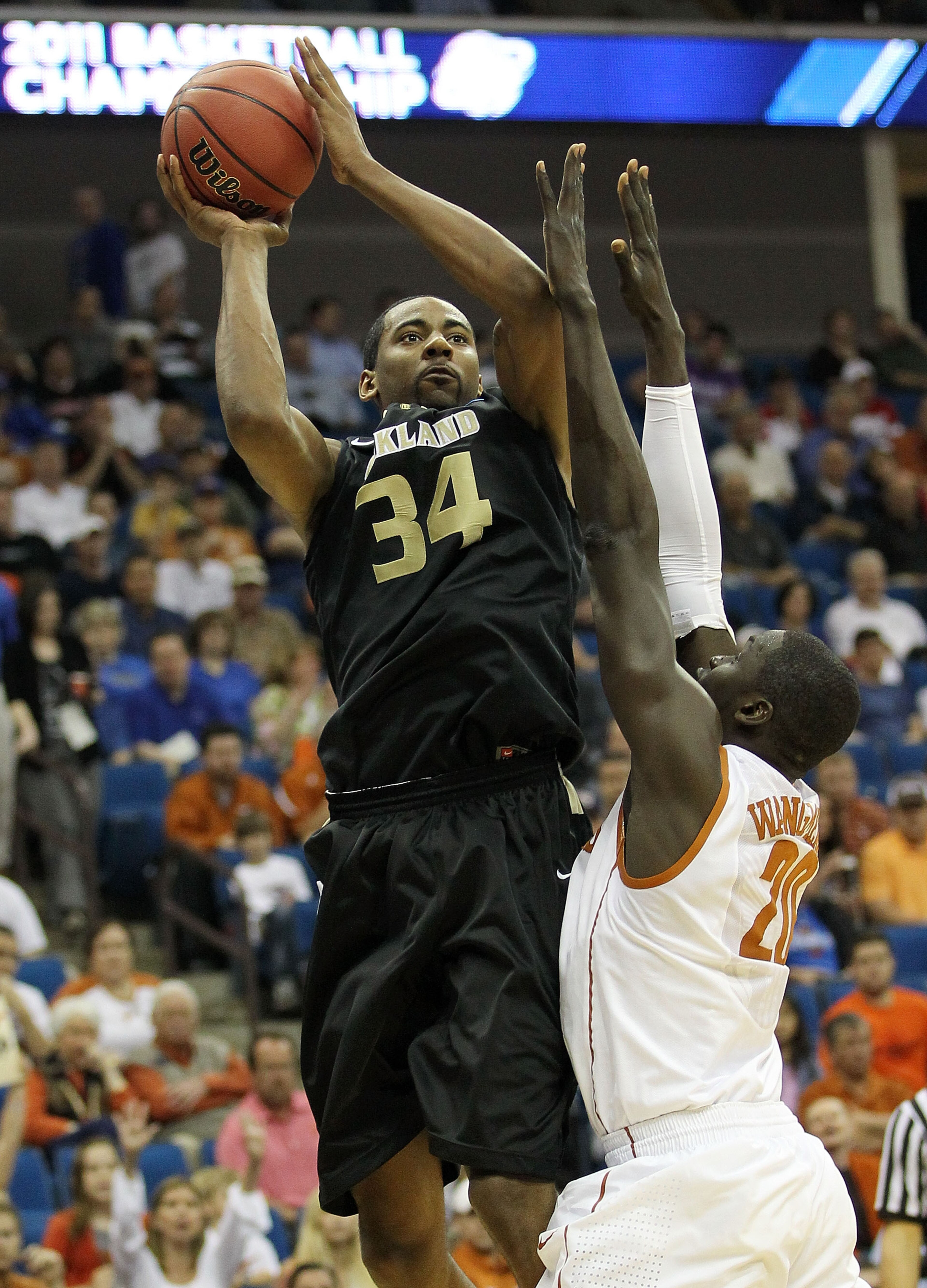 TULSA, OK - MARCH 18: Keith Benson #34 of the Oakland Golden Grizzlies goes up for a shot against Alexis Wangmene #20 of the Texas Longhorns during the second round game of the 2011 NCAA men's basketball tournament at BOK Center on March 18, 2011 in Tuls TULSA, OK - MARCH 18: Keith Benson #34 of the Oakland Golden Grizzlies goes up for a shot against Alexis Wangmene #20 of the Texas Longhorns during the second round game of the 2011 NCAA men's basketball tournament at BOK Center on March 18, 2011 in Tuls