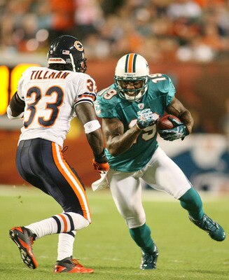 MIAMI - NOVEMBER 18:  Receiver Brandon Marshall #19 of the Miami Dolphins runs as safety Charles Tillman #33 of the Chicago Bears defends at Sun Life Stadium on November 18, 2010 in Miami, Florida.  (Photo by Marc Serota/Getty Images)