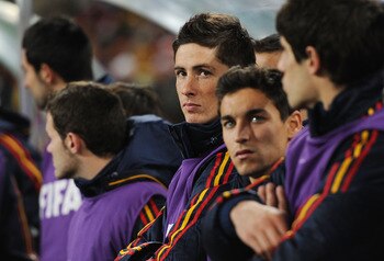 JOHANNESBURG, SOUTH AFRICA - JULY 11:  Fernando Torres of Spain looks on from the substitutes bench during the 2010 FIFA World Cup South Africa Final match between Netherlands and Spain at Soccer City Stadium on July 11, 2010 in Johannesburg, South Africa