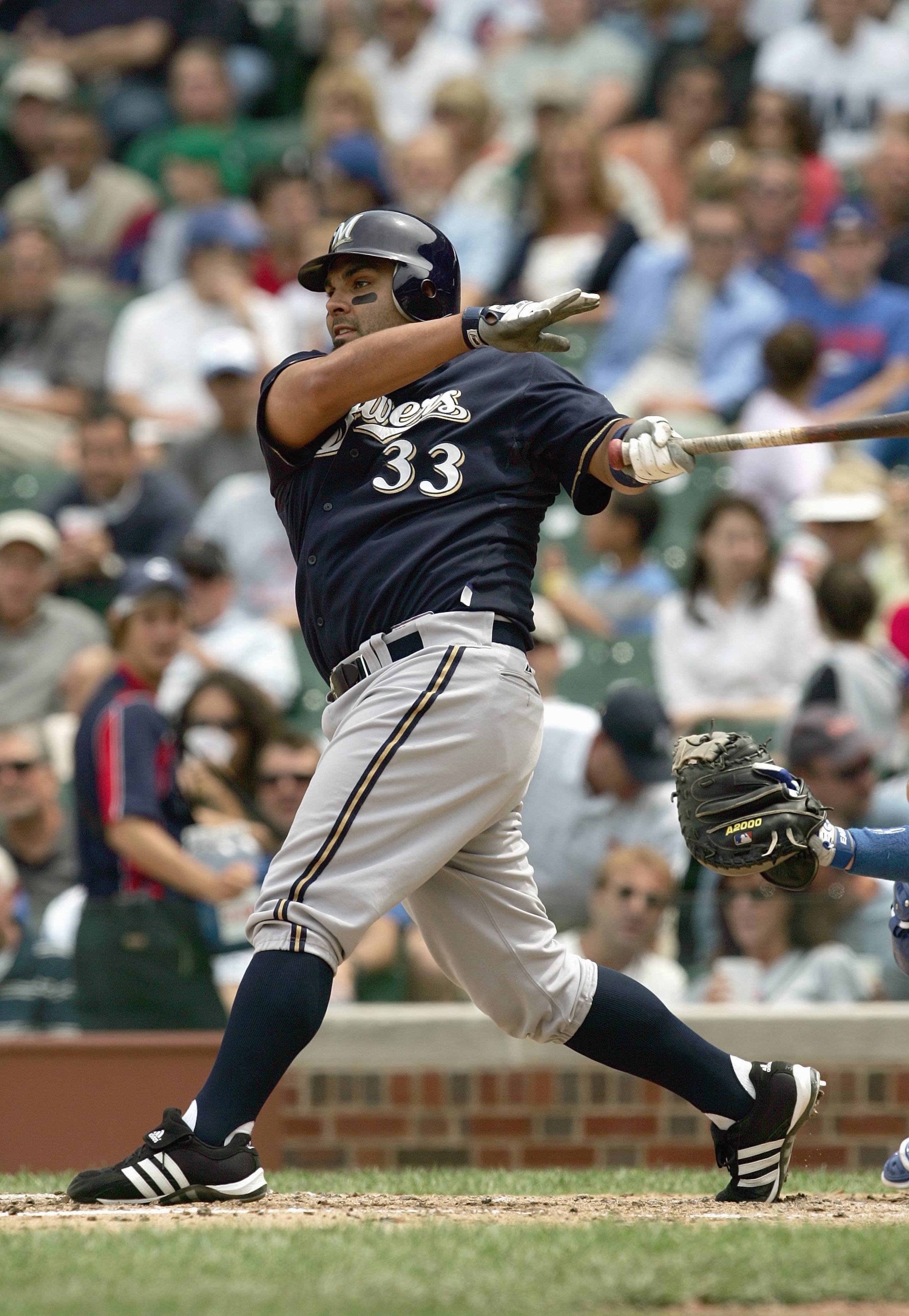 CHICAGO - JUNE 29: Johnny Estrada #33 of the Milwaukee Brewers swings at the pitch during the game against the Chicago Cubs on June 29, 2007 at Wrigley Field in Chicago, Illinois. (Photo by: Jonathan Daniel/Getty Images)