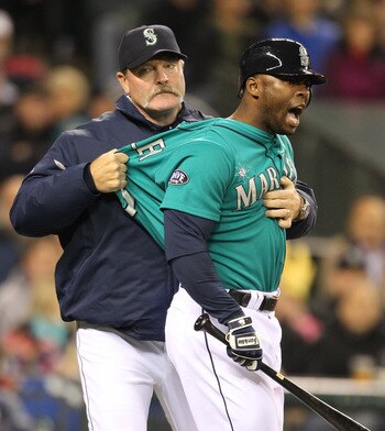 SEATTLE - FILE:  Milton Bradley #15 of the Seattle Mariners is restrained by manager Eric Wedge #22 after being ejected from the game against the Chicago White Sox at Safeco Field on May 6, 2011 in Seattle, Washington. According to reports May 9, 201, Bra