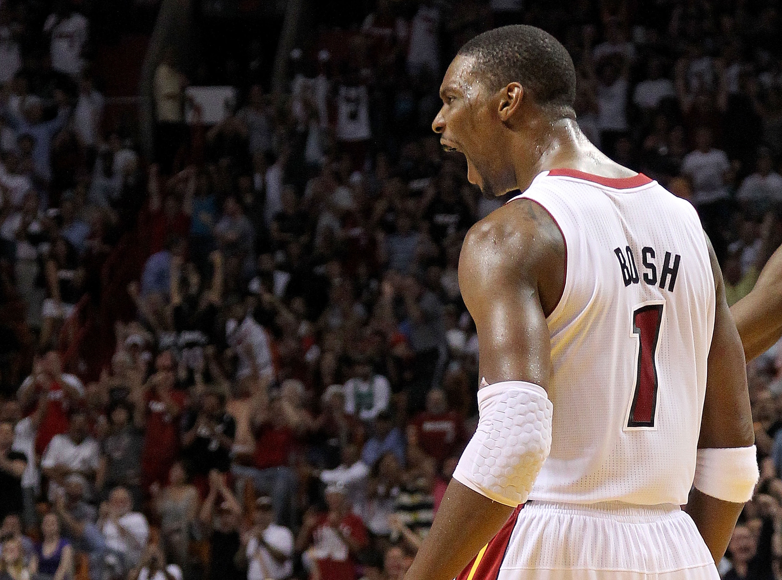 MIAMI, FL - APRIL 10: Chris Bosh #1 of the Miami Heat reacts after being fouled during a game against the Boston Celtics at American Airlines Arena on April 10, 2011 in Miami, Florida. NOTE TO USER: User expressly acknowledges and agrees that, by download MIAMI, FL - APRIL 10: Chris Bosh #1 of the Miami Heat reacts after being fouled during a game against the Boston Celtics at American Airlines Arena on April 10, 2011 in Miami, Florida. NOTE TO USER: User expressly acknowledges and agrees that, by download