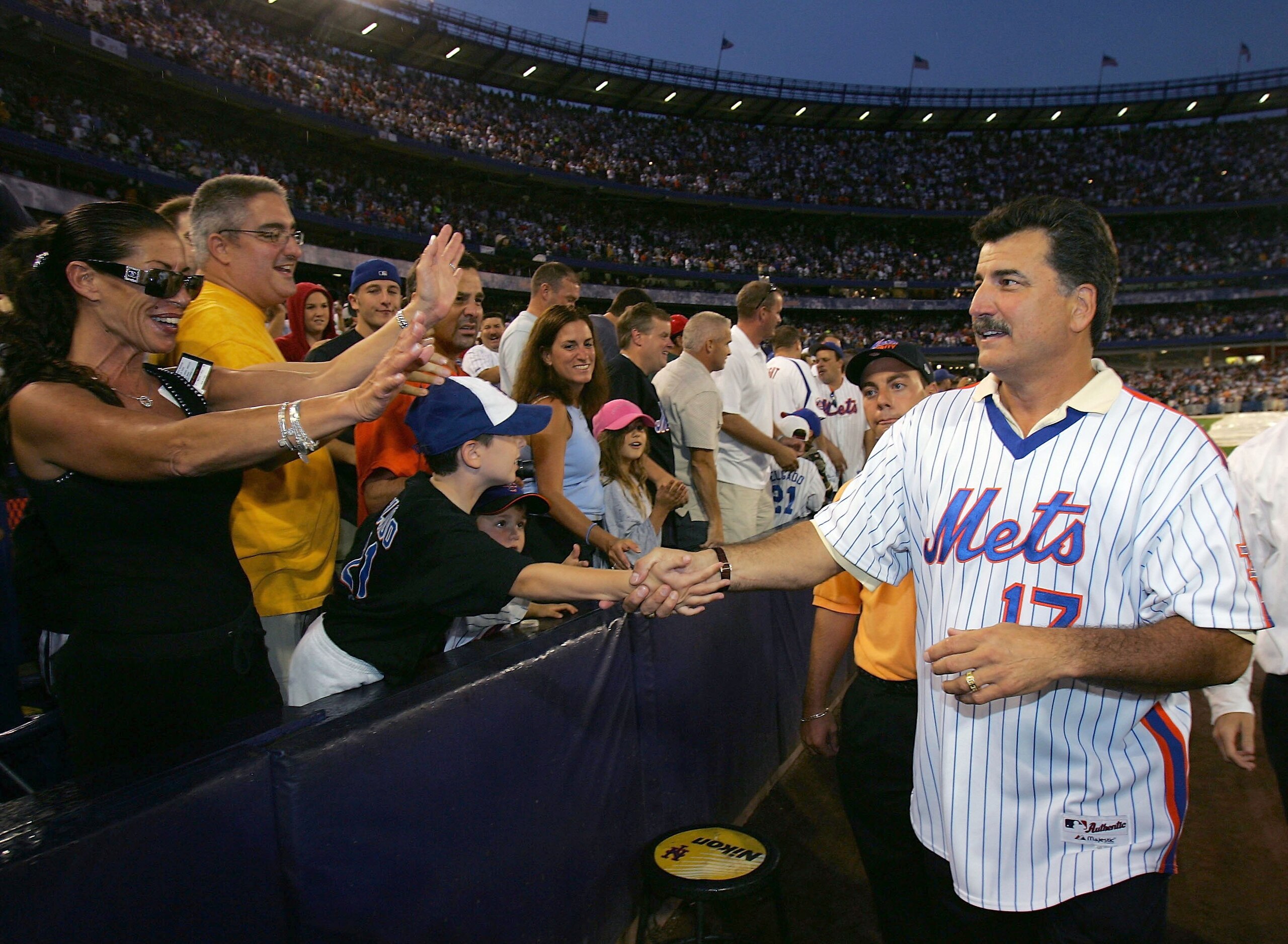 NEW YORK - AUGUST 19: Keith Hernandez a member of the 1986 New York Mets greets fans after a tribute to mark the 20th Anniversary of their World Series win, before the New York Mets played the Colorado Rockies at Shea Stadium August 19, 2006 in the Queen NEW YORK - AUGUST 19: Keith Hernandez a member of the 1986 New York Mets greets fans after a tribute to mark the 20th Anniversary of their World Series win, before the New York Mets played the Colorado Rockies at Shea Stadium August 19, 2006 in the Queen